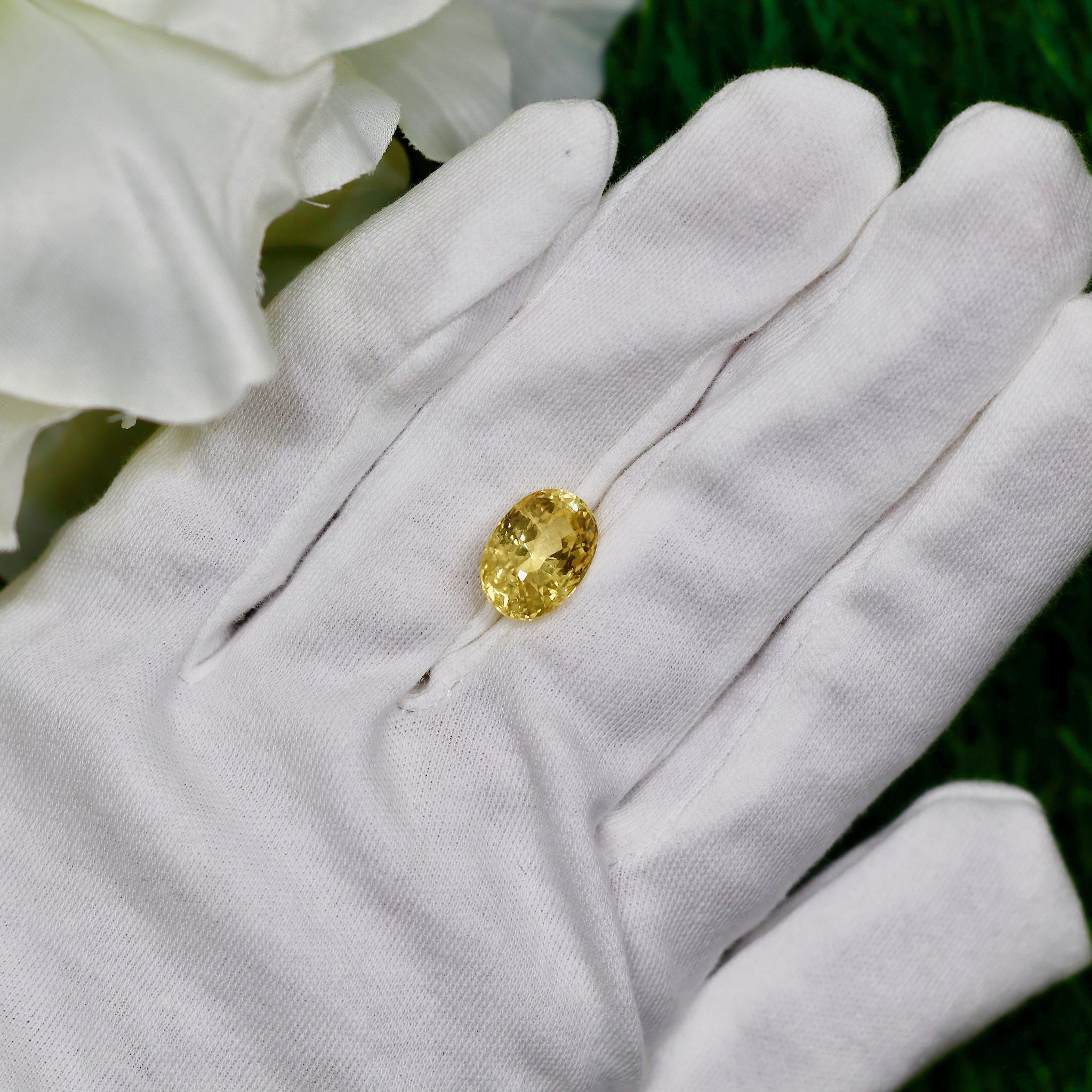 It comes with the GIA Laboratory Certificate
Carat Weight: 9.69 Carats
Origin: Natural, Unheated
Geographic Origin: Sri Lanka
Measurements: 14.27 x 9.92 x 8.17mm
Color: Yellow
Cut: Oval