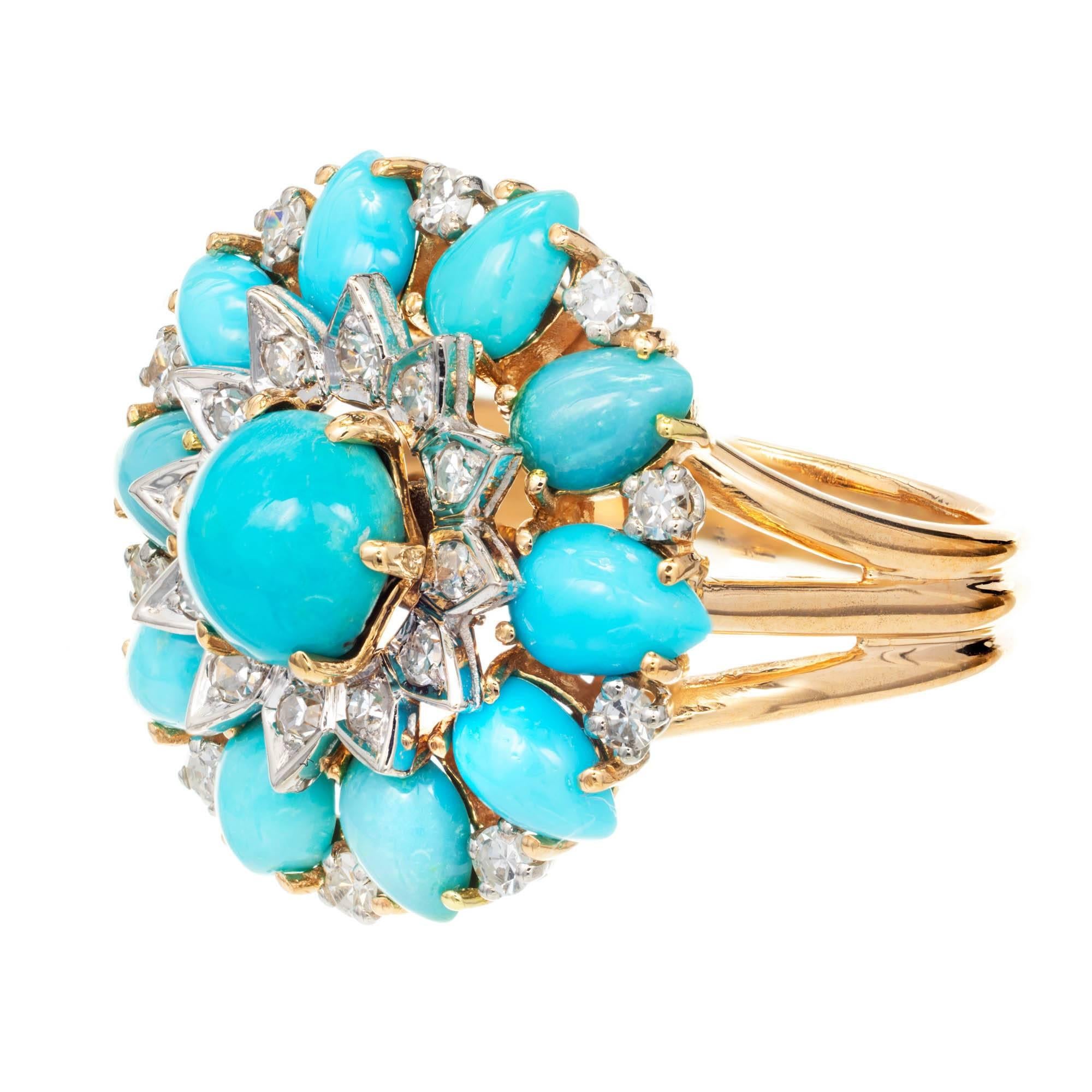Persian natural untreated turquoise and diamond cluster cocktail ring. Handmade in France Circa 1950s in 18k Gold with single cut diamonds and bright high luster. GIA certified natural Persian turquoise.

1 round cabochon turquoise greenish blue