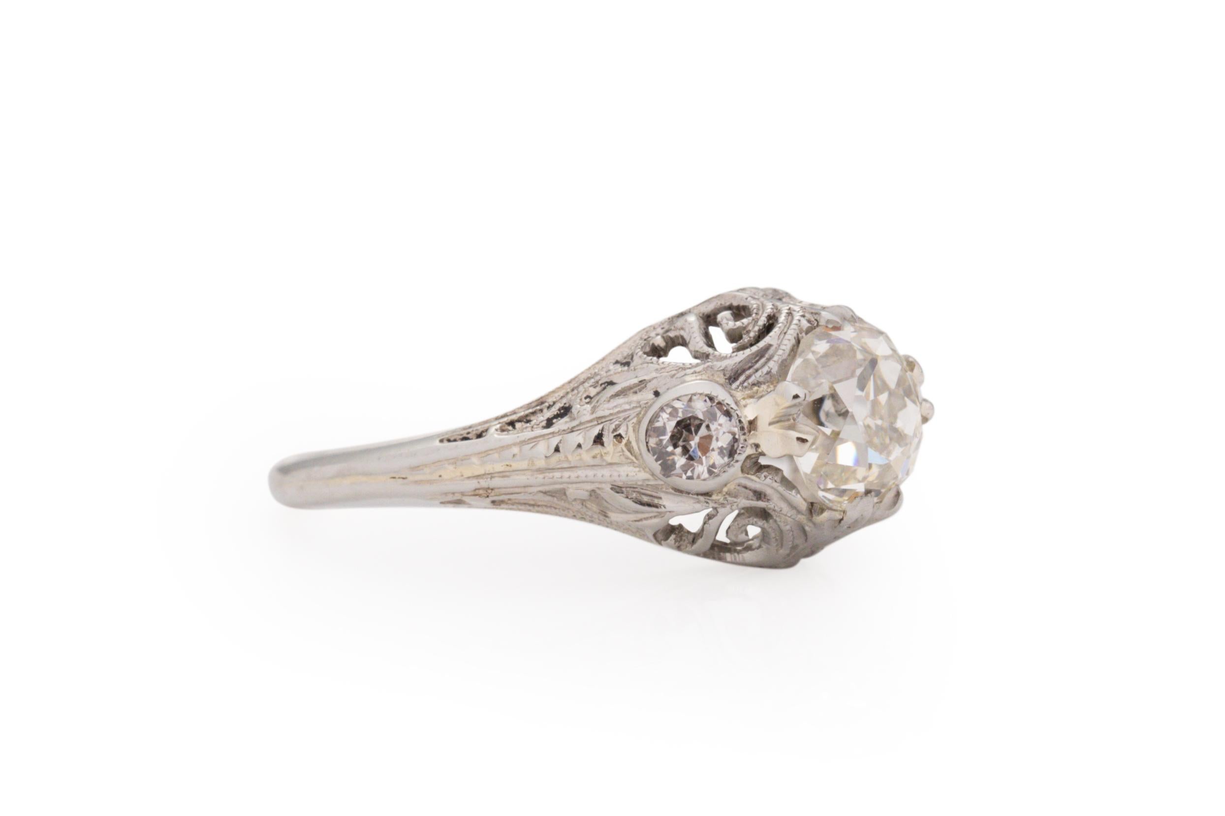 Ring Size: 4.75
Metal Type: 18 karat White Gold [Hallmarked, and Tested]
Weight: 2.5 grams

Center Diamond Details:
GIA REPORT #: 2387601883
Weight: .99 carat
Cut: Antique Cushion
Color: M
Clarity: VS1
Measurements: 6.01mm X 5.46mm x 4.03mm

Side