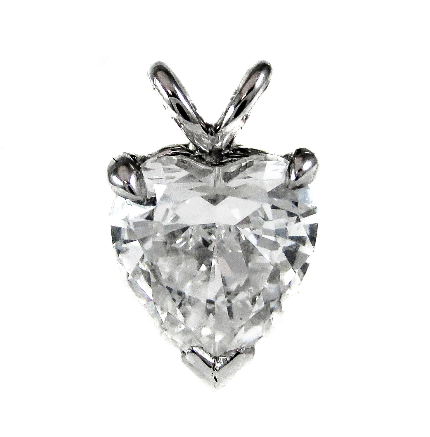 A chic bright white heart shaped diamond, with a GIA color grade of D and clarity VS2, is set in a platinum prong setting and chain that is great for everyday wear. The extremely well cut heart-shape diamond displays an incredible amount of sparkle,