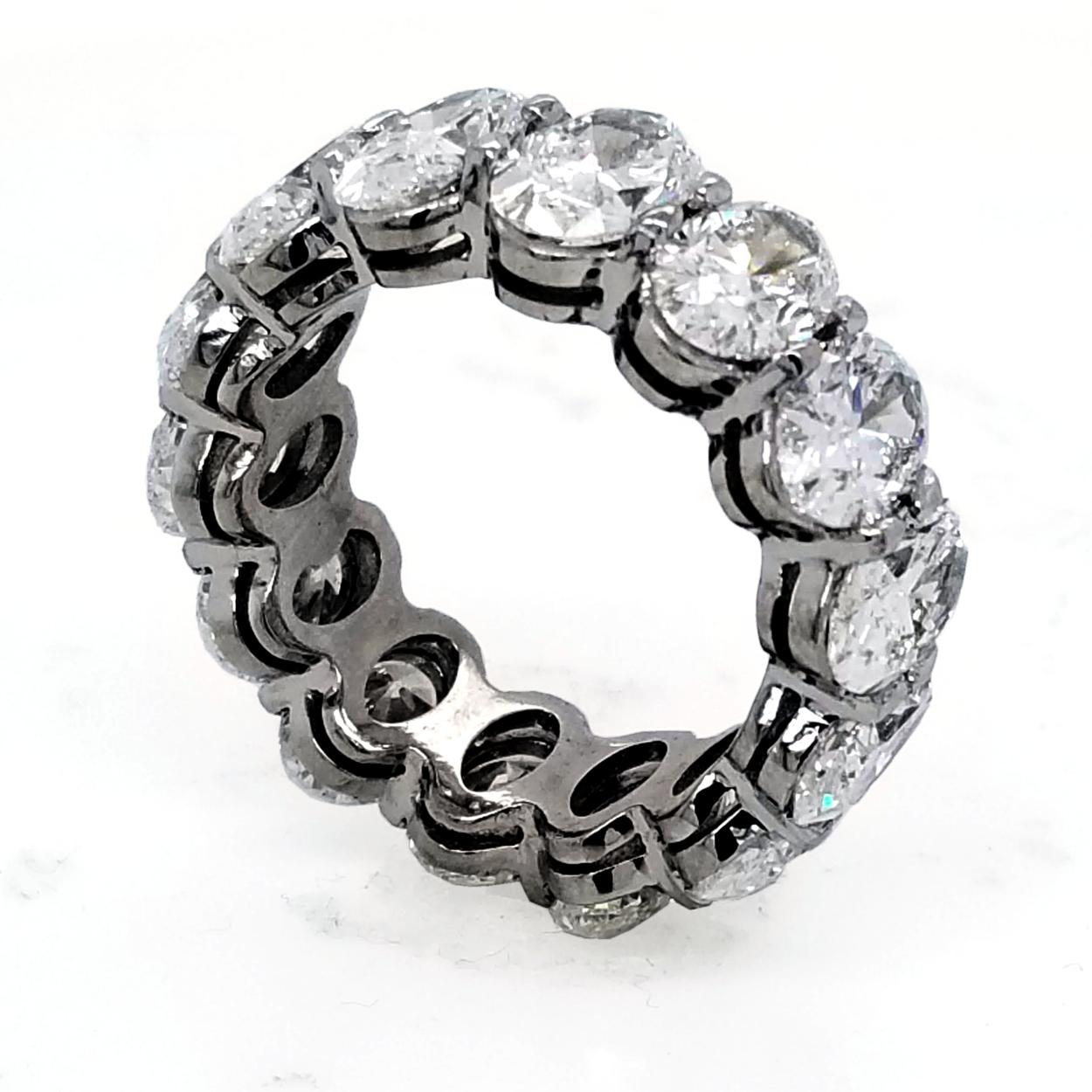 This beautiful Eternity Ring is made of Platinum showcasing 14 perfectly matched GIA Certified (E-F/VS2-SI1)  Oval Brilliant Diamonds Set in Shared Prong Mode.
6 diamonds are E Color and 8 are F Color
3 diamonds are VS2 Clarity and 11 are SI1