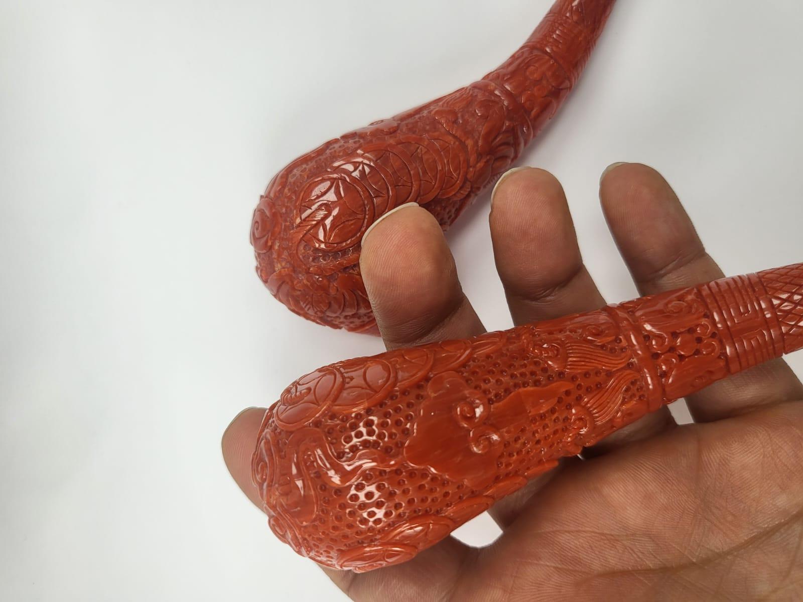 Artisan GIA Certified, a pair of natural, carved Coral Pipes For Sale