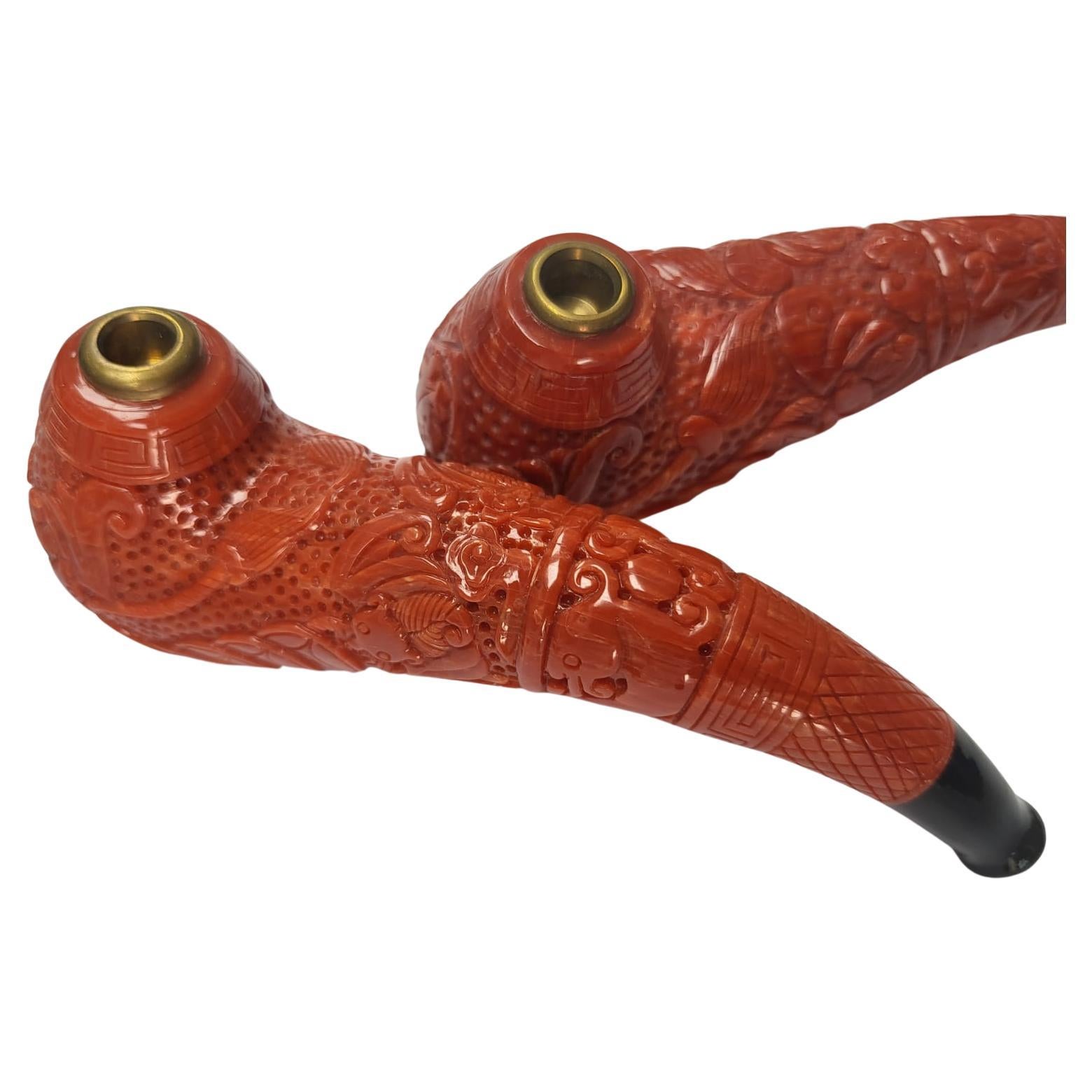 GIA Certified, a pair of natural, carved Coral Pipes For Sale