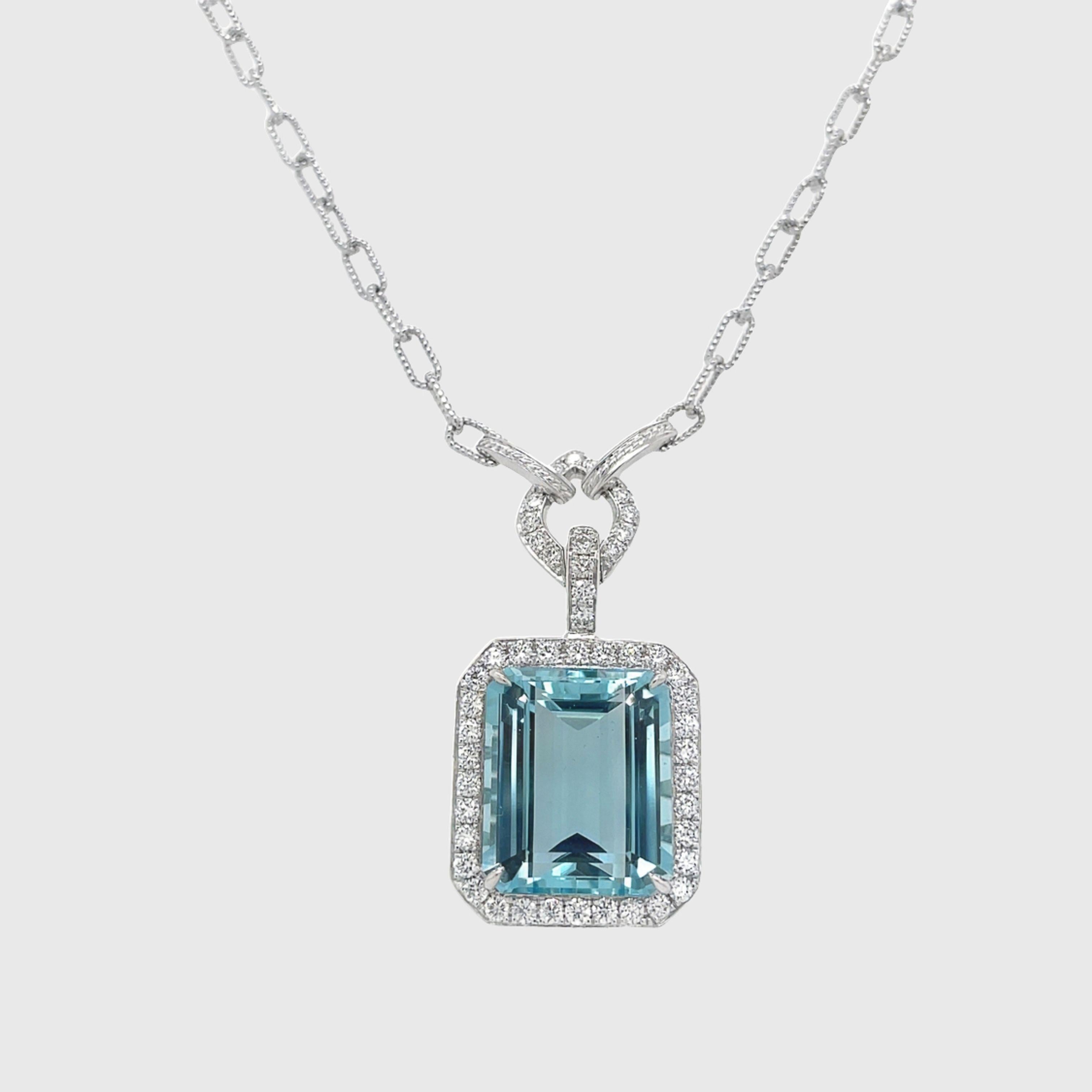 Necklace contains one center emerald cut aquamarine gemstone weighing 14.66cts. 
Center aqua is surrounded by a square halo of round brilliant diamonds weighing a total of 1.25cts. Aqua is GIA certified. Diamonds are F in color and VS2 in clarity,