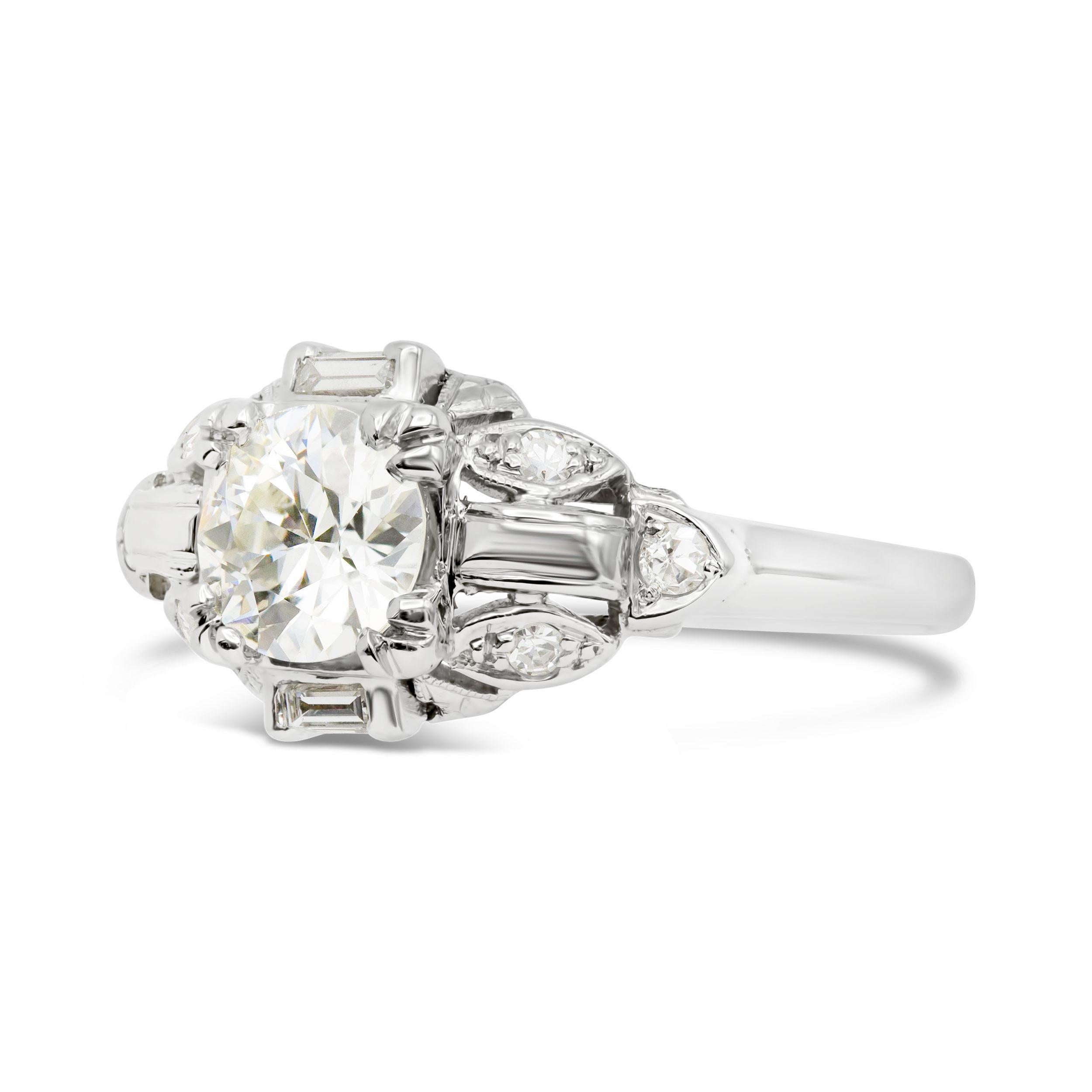 This charming thing! We love deco frame settings and this engagement ring has so much character. The center 0.82 carat old European cut diamond, certified K VS2 by GIA, is fiery and sparkles like crazy on the hand. Accenting single cuts and straight