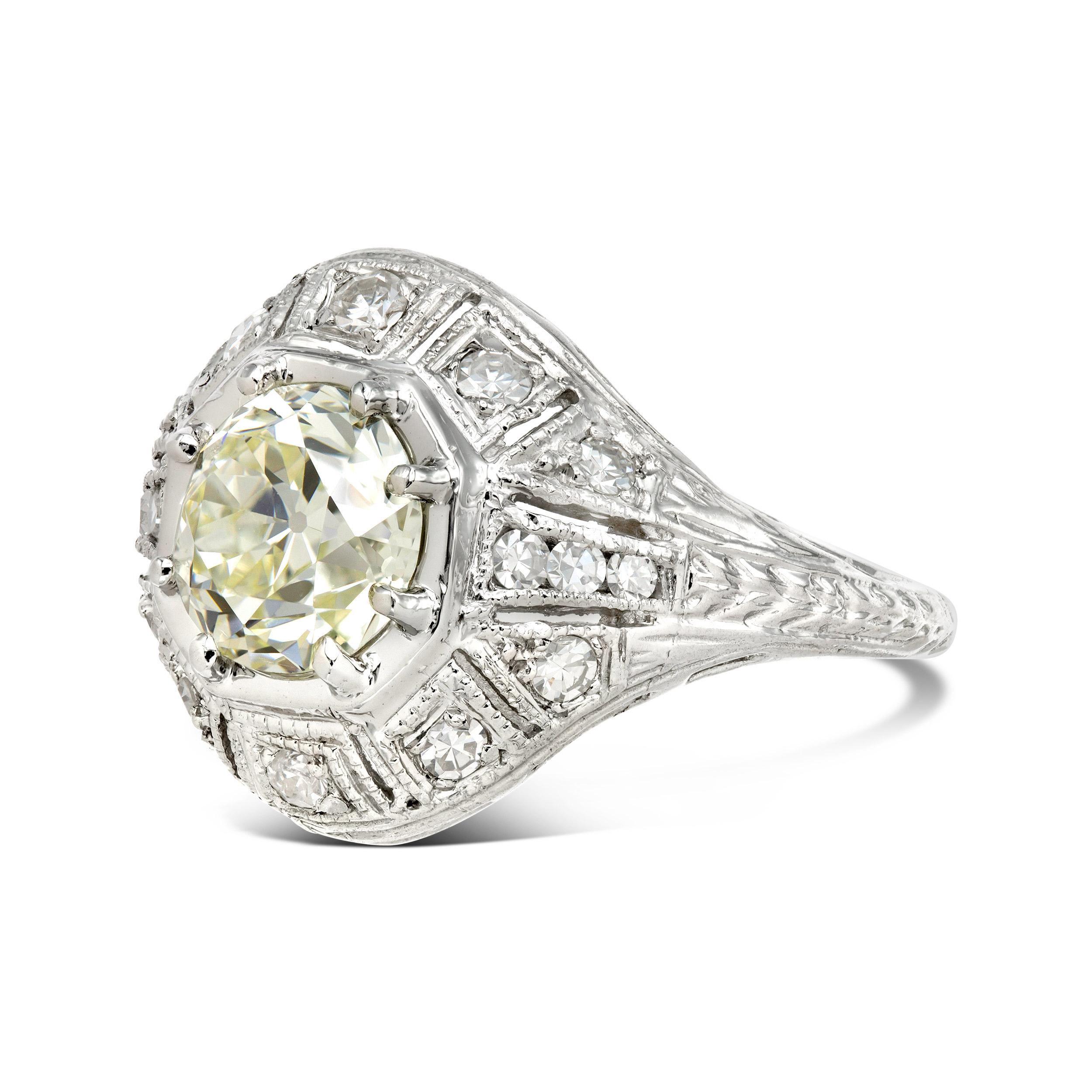 Diamond Details

Primary Stone: 1.51 ct. Old European  
Color/Clarity: M / VS1, GIA Certified
Accent Stones: (16) single cut diamonds
Accent Stone Weight: 0.30 ct. 
Accent Color/Clarity:  H-I / VS
Ring Specifications

Total Diamond Weight: 1.81