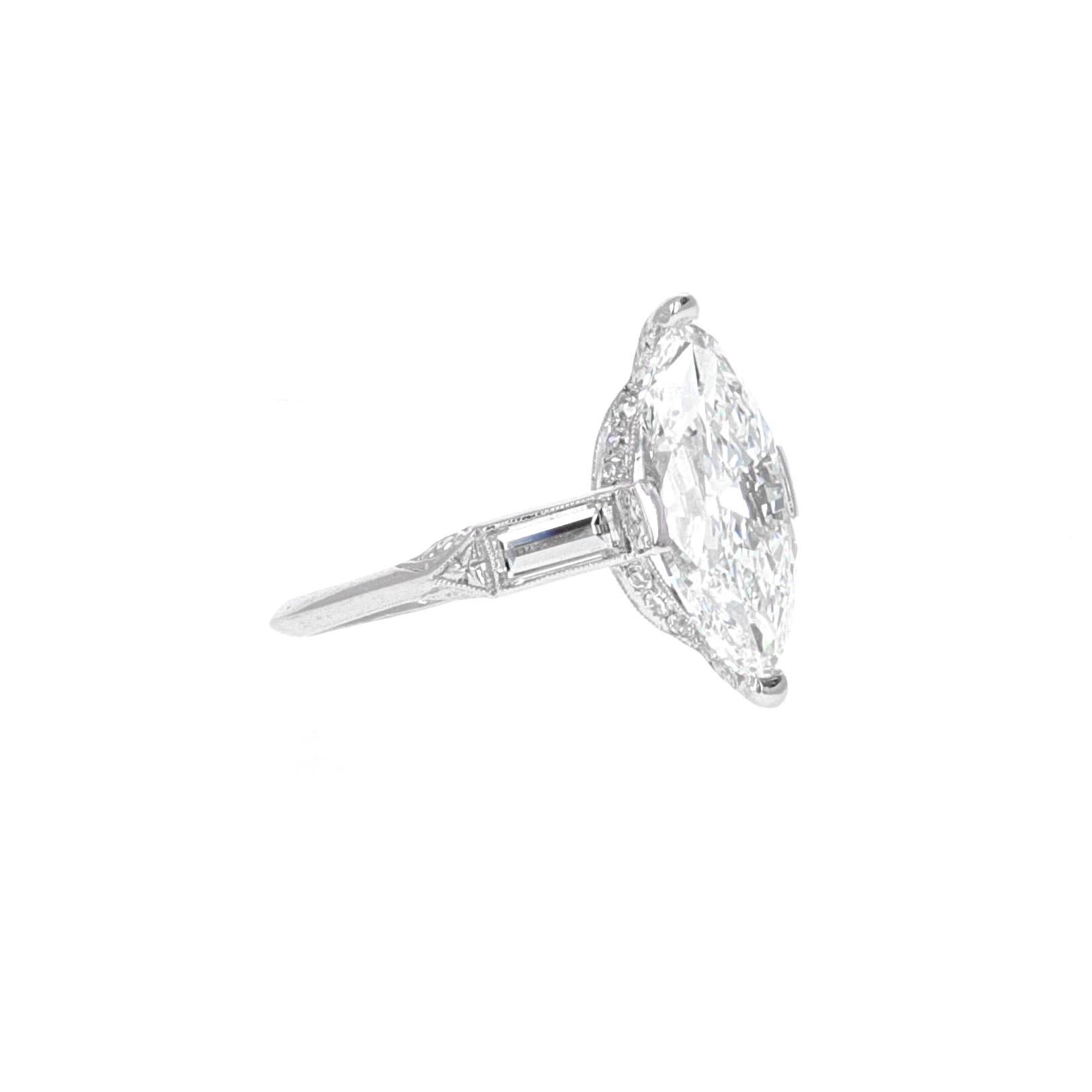 Art deco, GIA certified, 4.02 carat antique marquise diamond bridal engagement ring mounted in platinum. This stunning art deco style marquise ring is a classic example of the style trends in the 1920's decade. The GIA graded this stone as a 4.02
