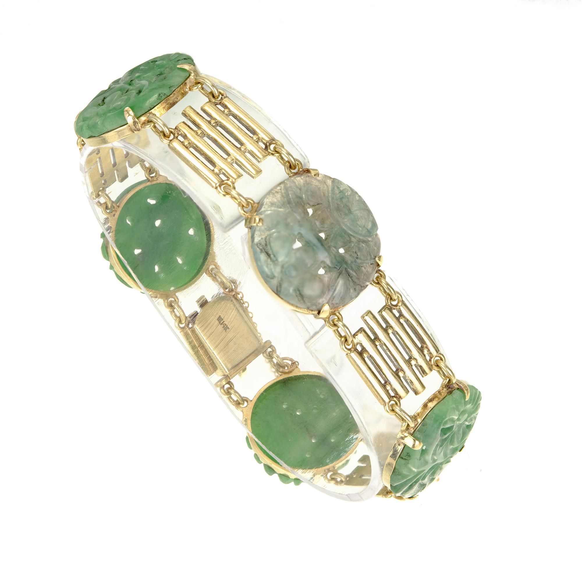 1940's Art Deco Jade bracelet in slightly green gold with certified untreated round Jadeite Jade.

5 green 18.7mm x 2.0mm round carved Jadeite Jade, natural, no enhancements and no treatments, GIA certificate #2205069196
Length: 7 inches
14k green