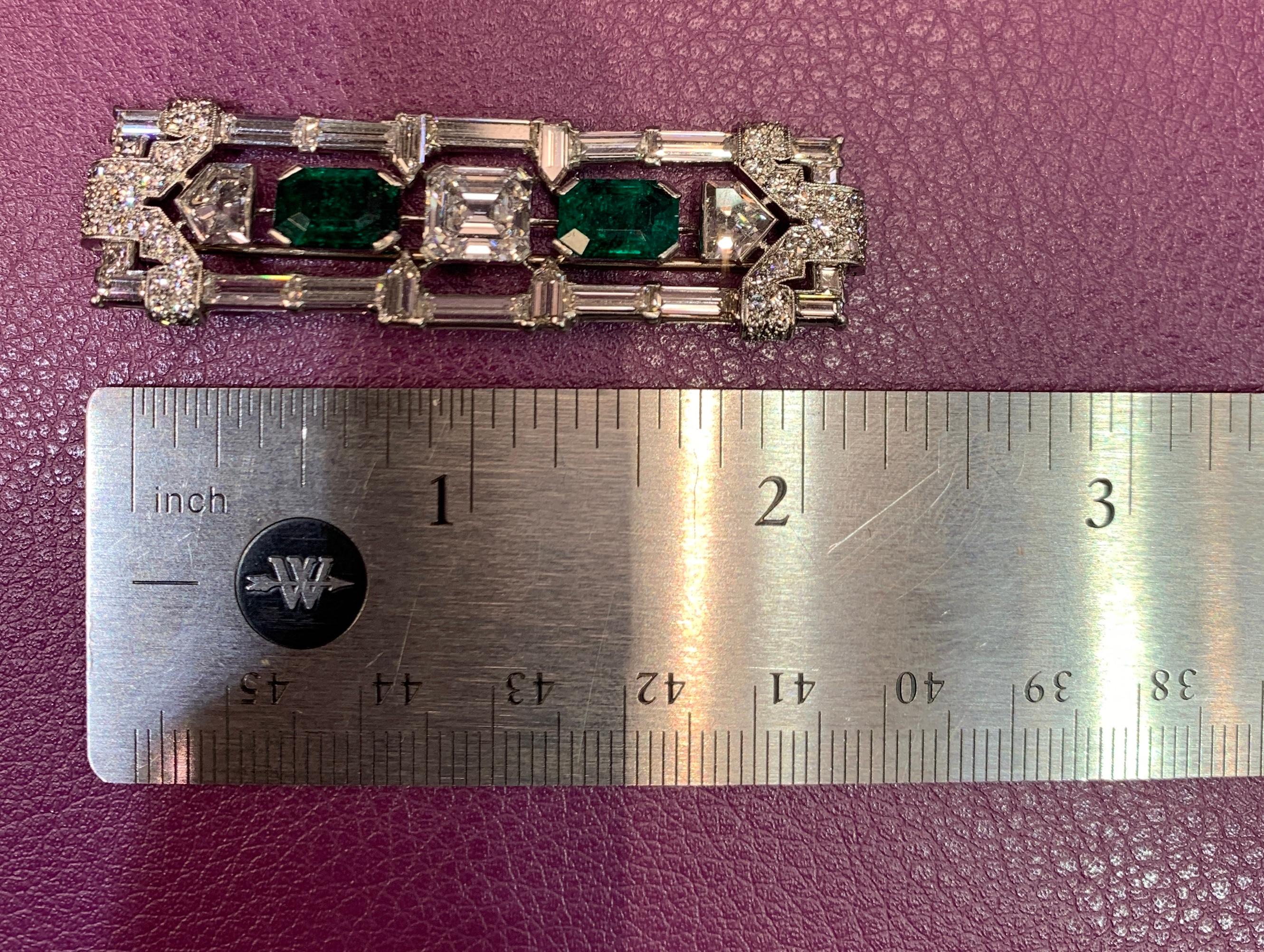 Gia Certified Art Deco Diamond and Emerald Brooch 
Has a GIA certified Square emerald cut diamond weighing 2.10 carats and 
