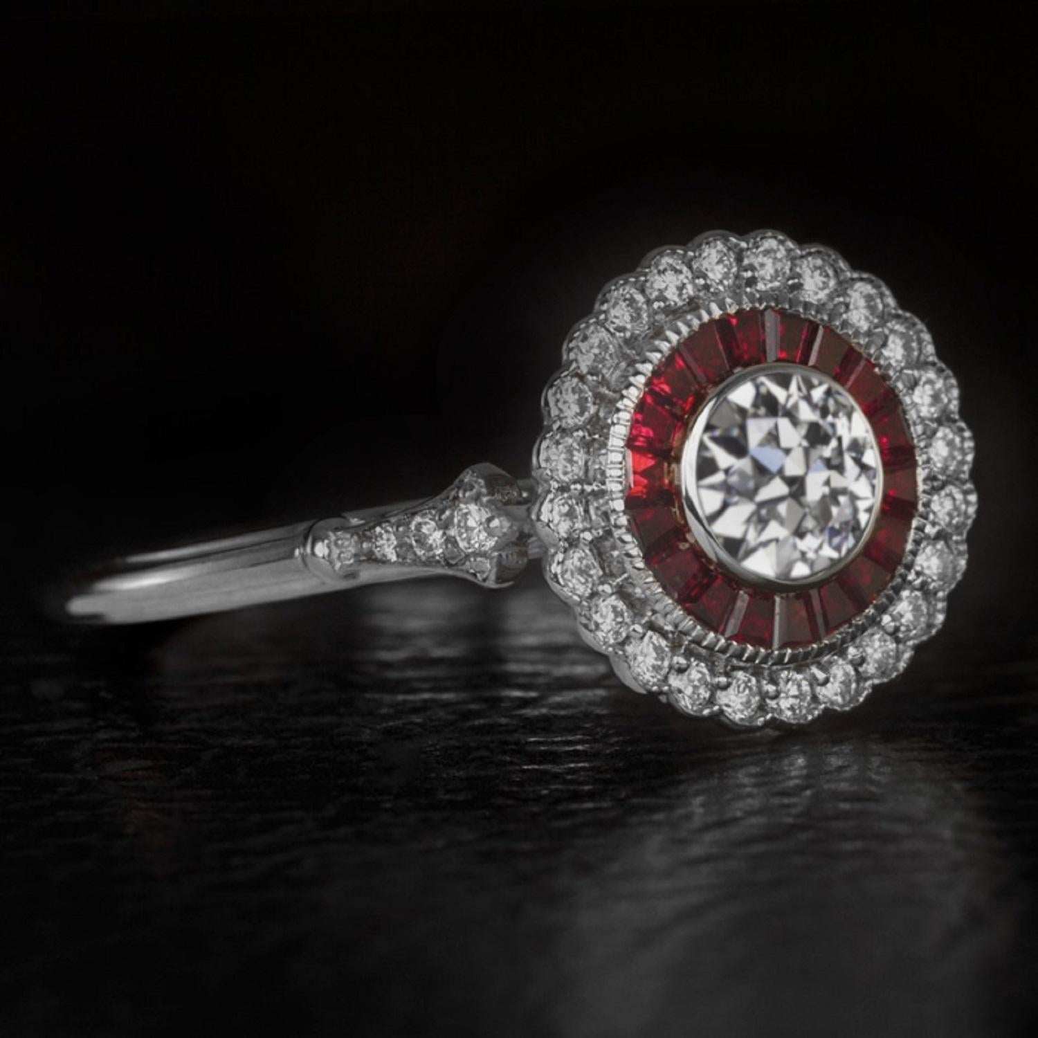 A gorgeous GIA diamond and ruby halo engagement ring setting! This unique ring was inspired by the early 1900's and it is full of gorgeous vintage charm. 

This is an incredible piece of craftsmanship because each ruby was individually cut and