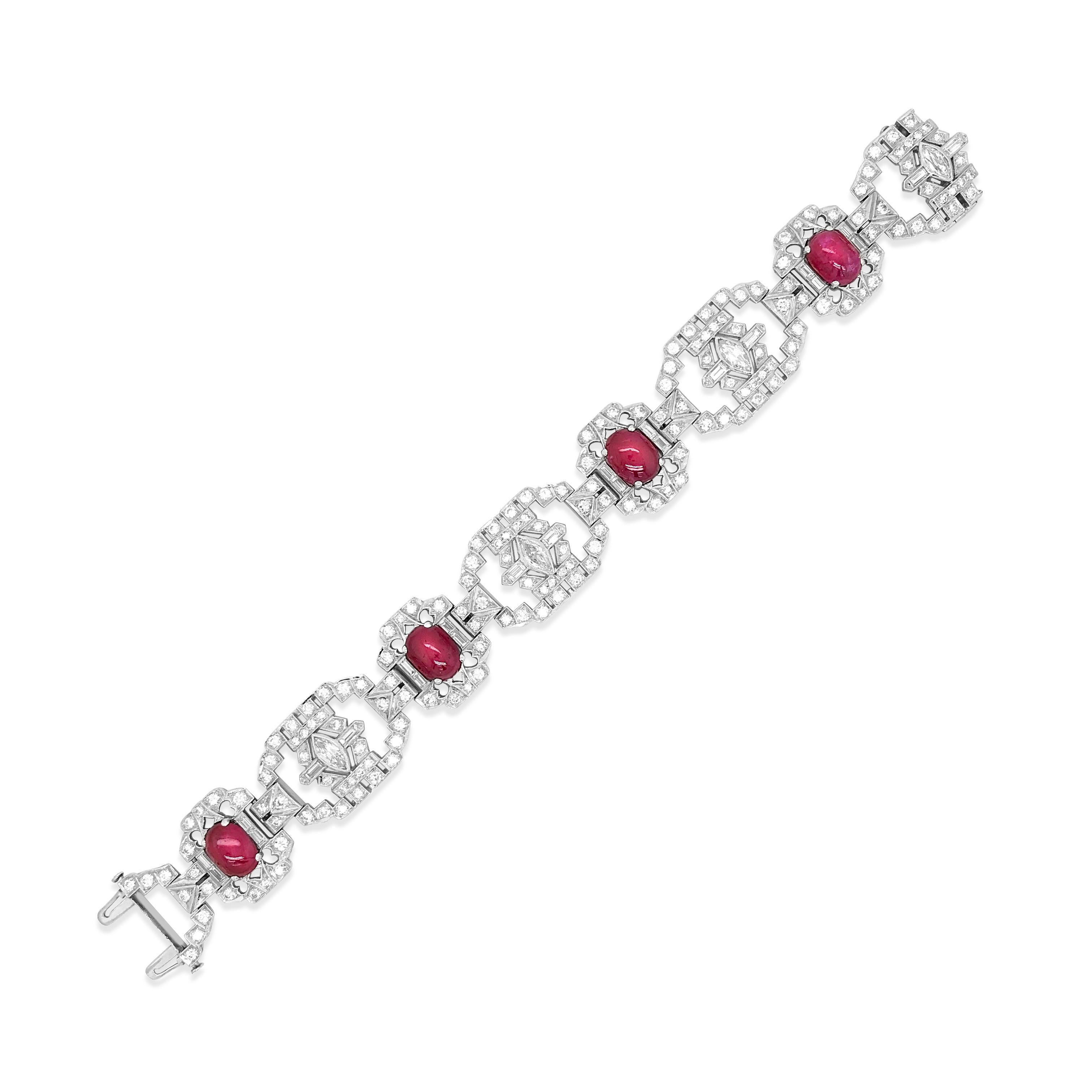 This stunning Burma origin and unheated ruby and diamond bracelet weighs 47.36 grams and measures 18.4cm (7.24 inches) long. Composed of openwork geometric links highlighted by 4 oval cabochon rubies approximately 13.75 cts, centering 4