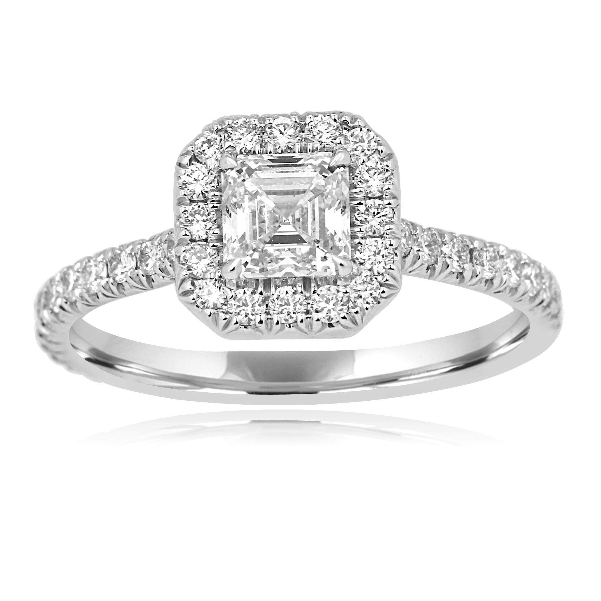 Absolutely Stunning GIA Certified Asscher Cut/ Square Emerald G Color SI1 Clarity 0.70 Carat encircled in a single Halo of Colorless Round Diamonds 0.55 Carat on Always in Style Classic 18K White Gold Bridal Engagement Ring.
MADE IN USA

Total