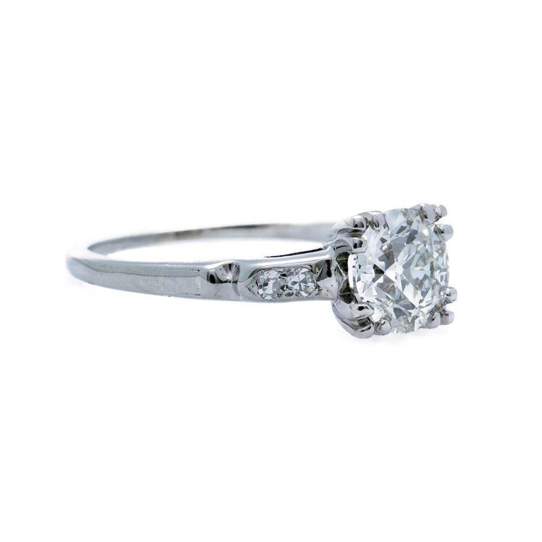 This beautiful authentic vintage Art Deco 18k white gold and diamond engagement ring features a 1.06 carat GIA certified old European cut diamond. Graded J color and VS2 clarity, the brilliant center stone is accented with four single cut diamonds