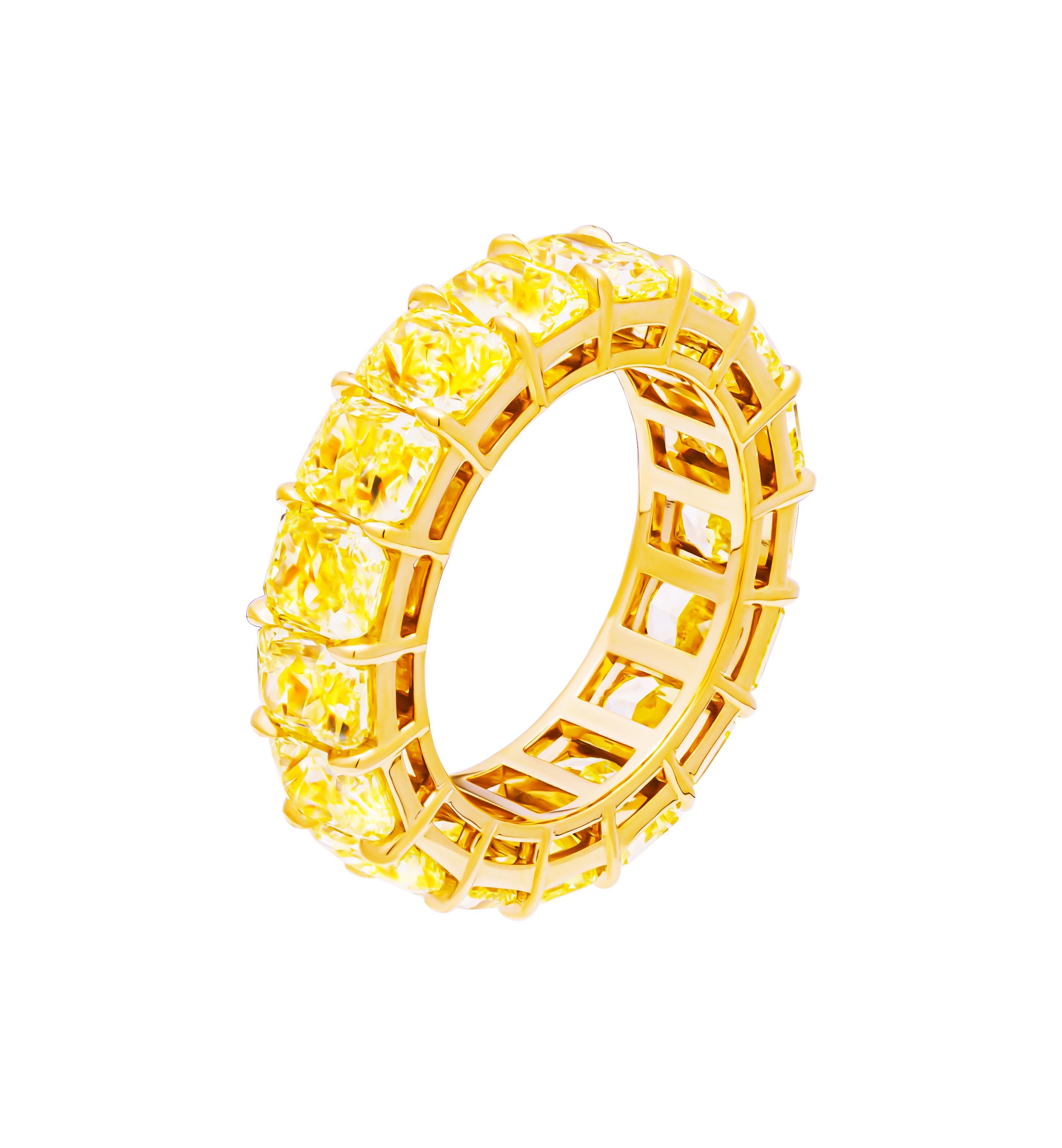 Introducing the breathtaking Eternityband, a radiant testament to timeless elegance and unparalleled beauty. Crafted in luxurious 18k yellow gold, this exquisite piece features a mesmerizing array of 17 GIA certified Fancy Intense Yellow radiant-cut