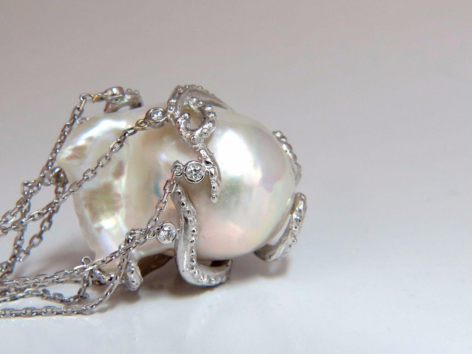 Octopus catch / dangle earrings.

30mm & 29mm natural Freshwater Baroque pearls.

GIA Certified

White with slight pink overtone.

clean clarity, No pits or naturals.

2.00cts of round natural color diamonds: 

G-color  Vs-2 clarity.

2.00ct (4)