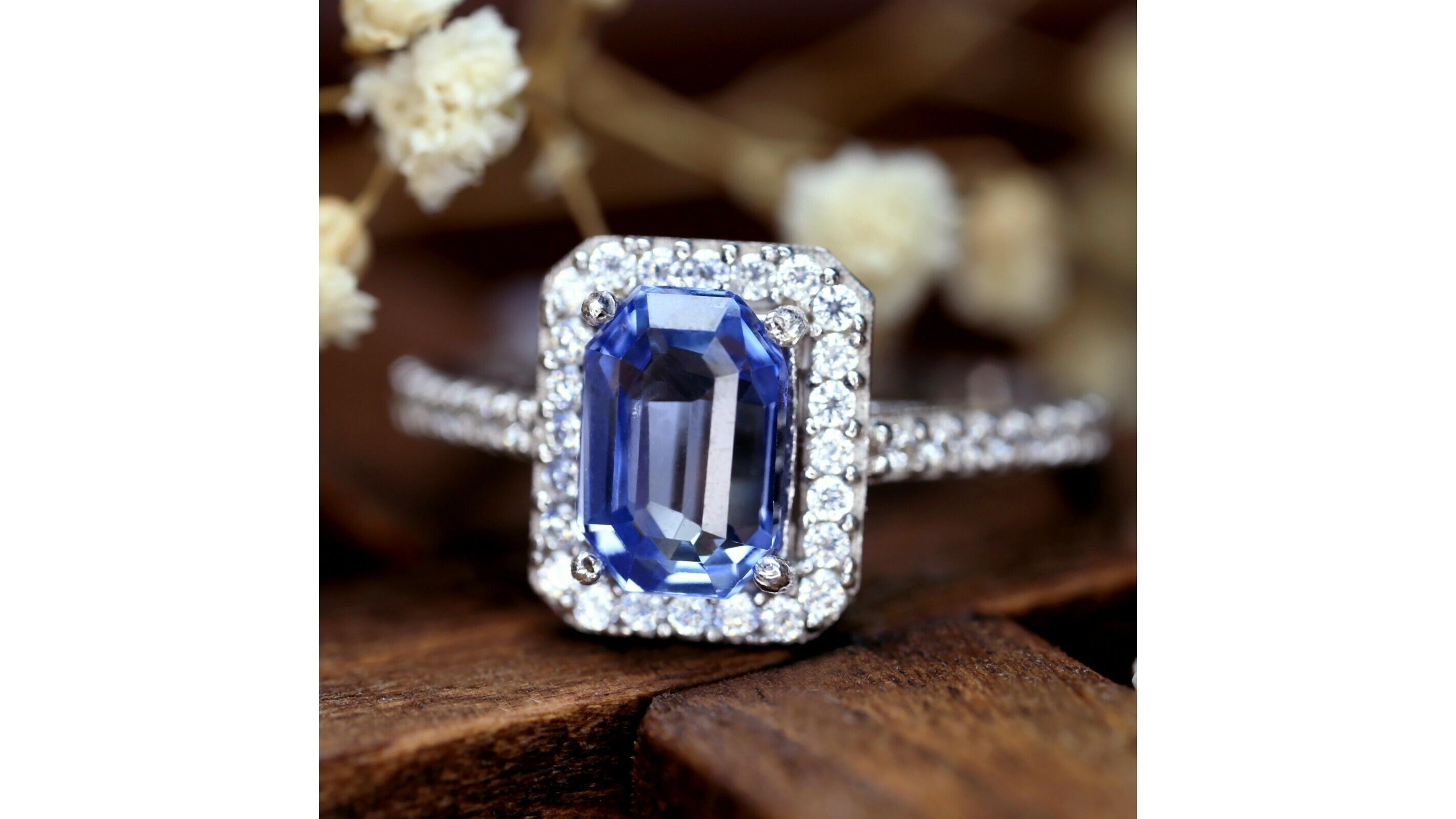 Gia Certified Blue 1.93 Carat Sapphire Diamond Ring 18 Karat .   This Emerald Cut Sapphire ring stands out with 37 diamonds and stands out in this emerald cut. If you are looking for anything specific let us know 

Gemstone
Natural