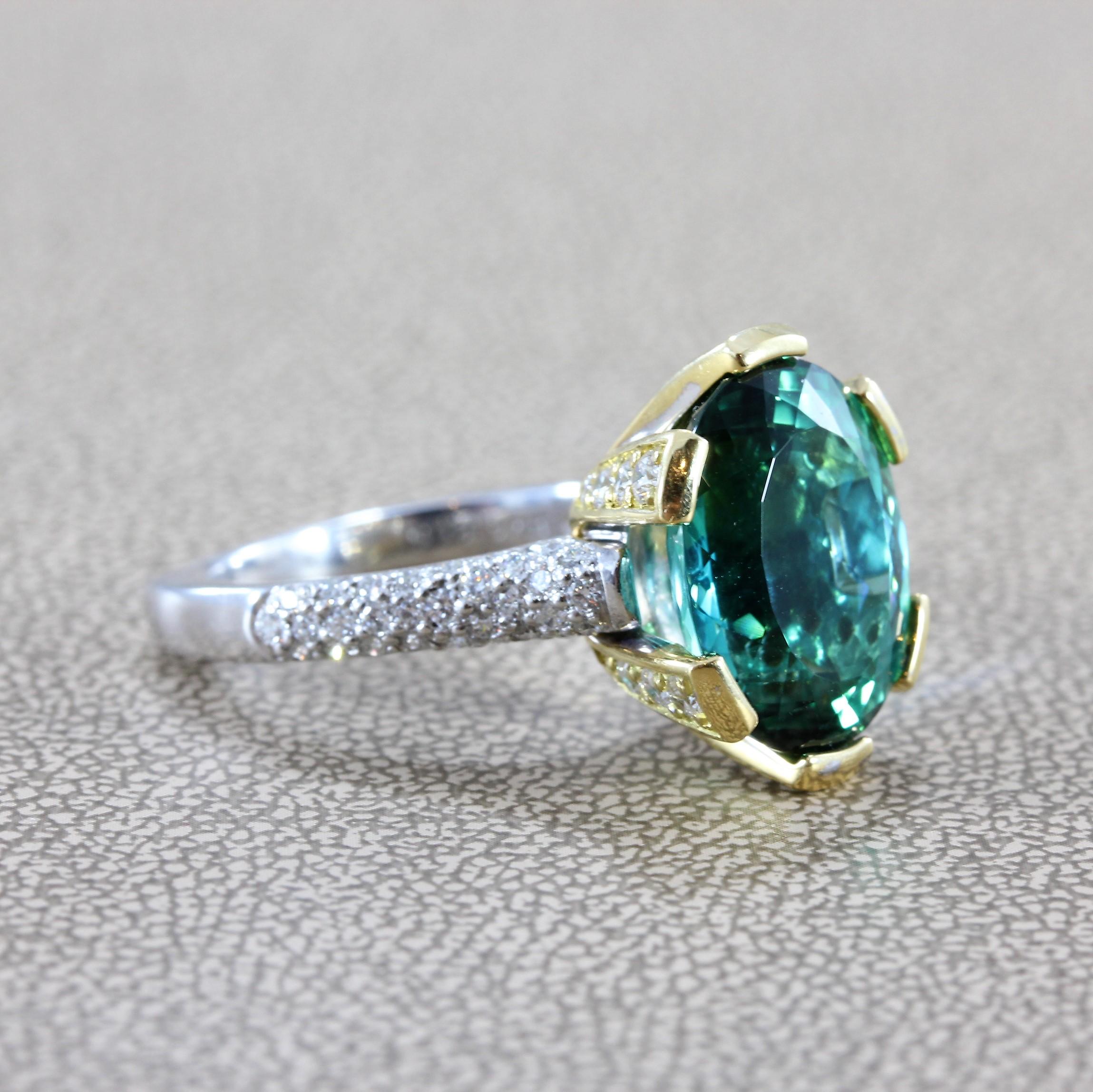 A magnificent gem tourmaline (8.30 carat), certified by GIA as natural Blue-Green color, set in 18K yellow gold. Accenting the ring are about 1.26 carats of VS quality colorless diamonds set in 18K yellow and white gold. A beautiful tourmaline