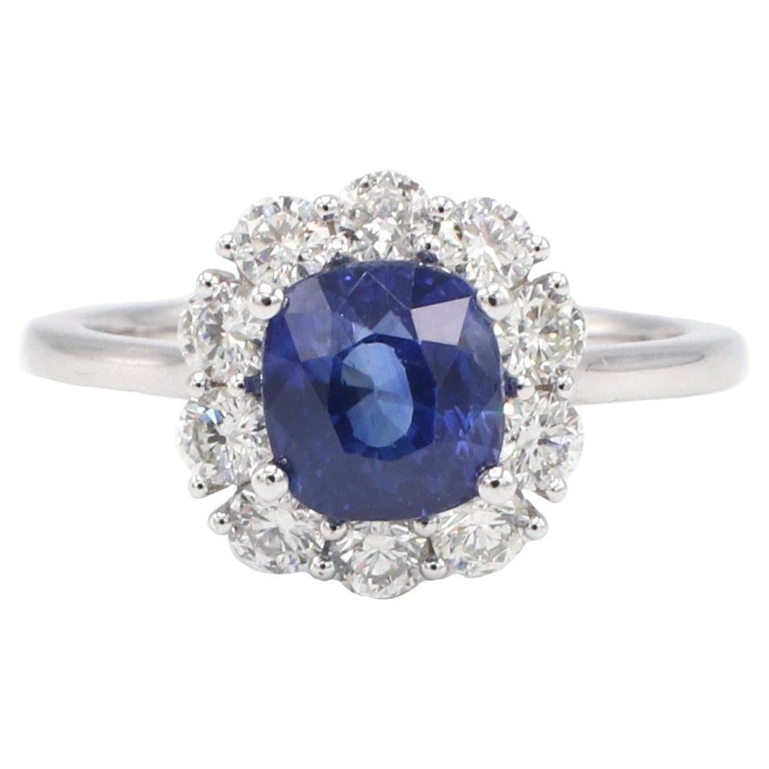 GIA Certified Blue Sapphire and Diamond Halo Platinum Ring For Sale at