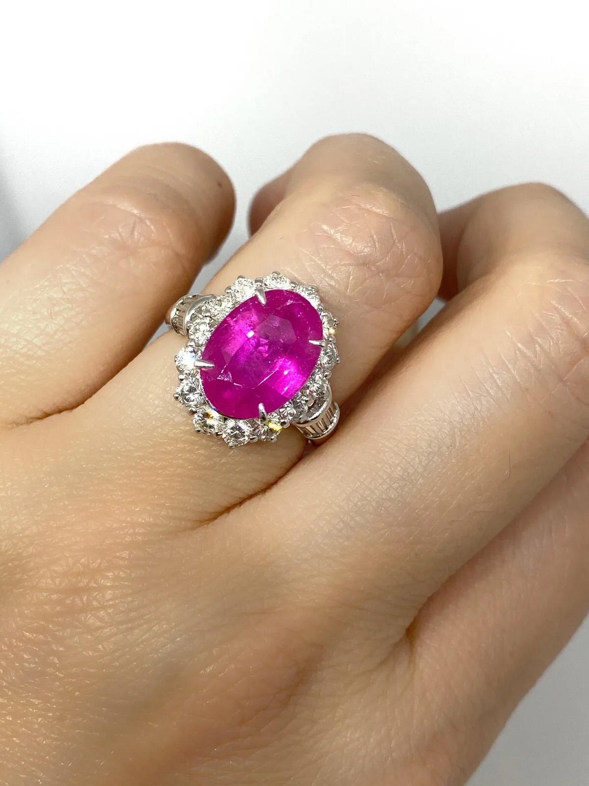 GIA Burma Heated Ruby 4.74 carat Oval in Diamond Platinum Ring

Ruby and Diamond Ring features a large Oval Purplish Red Ruby surrounded by 14 Round Brilliant and 10 Baguette Diamonds set in Platinum.

The Ruby originates from Burma(Myanmar) and has
