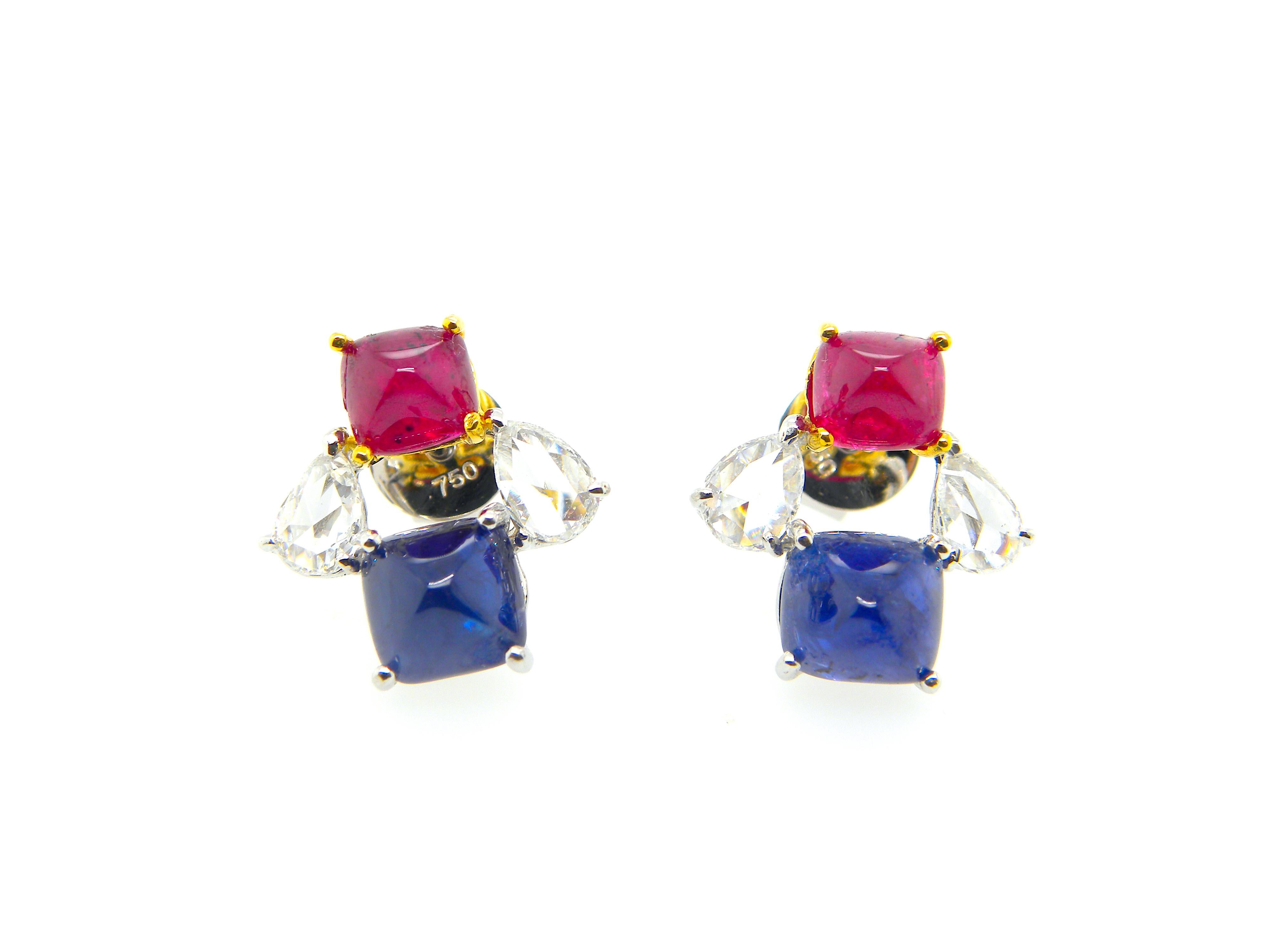 GIA Certified Burma No Heat Ruby and Sapphire Sugarloaf White Diamond Earrings:

A beautiful pair of earrings, it features luscious vivid red ruby and royal blue sapphire sugarloafs weighing a total of 7 carat, along with white rose-cut pear-shaped