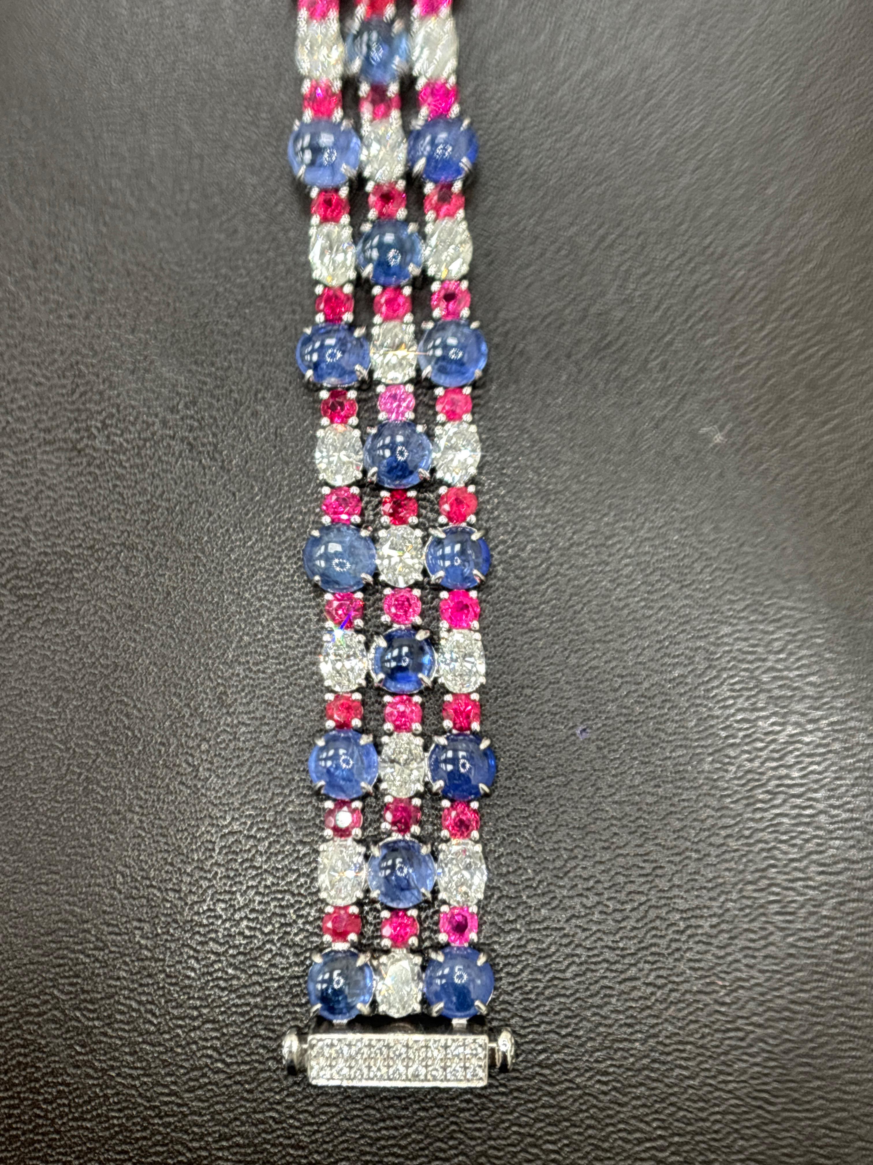 This exquisite bracelet embodies timeless elegance and sophisticated craftsmanship. Crafted in luminous platinum, it showcases a stunning array of vibrant gemstones that captivate the eye. At its center are rare GIA-certified Burmese no heat