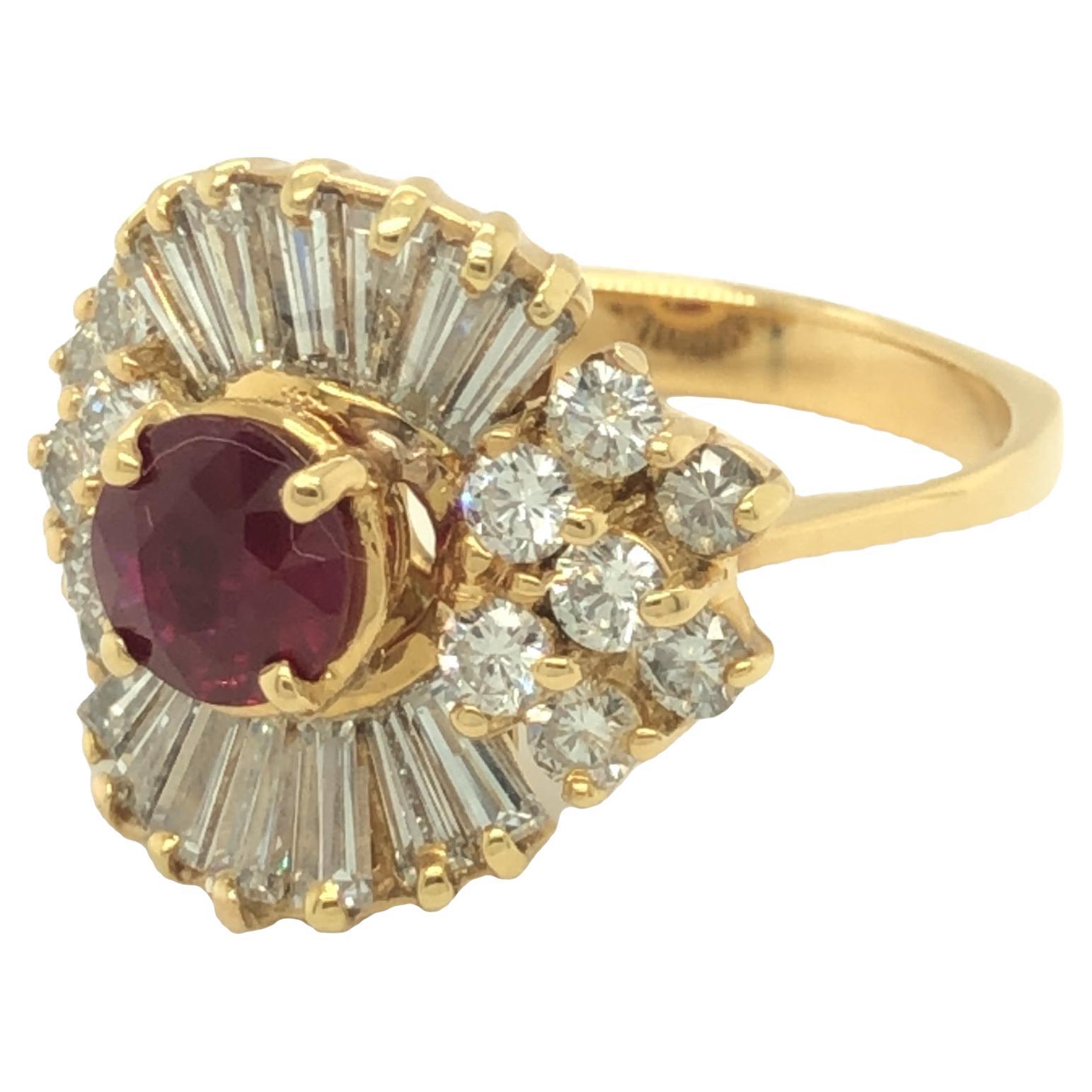 This ballerina ring is an old Hollywood glamour! GIA certified with a Burma ruby at center. The halo of fourteen round brilliant and fourteen tapered baguette cut diamonds are set in shimmering waves that resemble the gracefully ruffling skirt of a