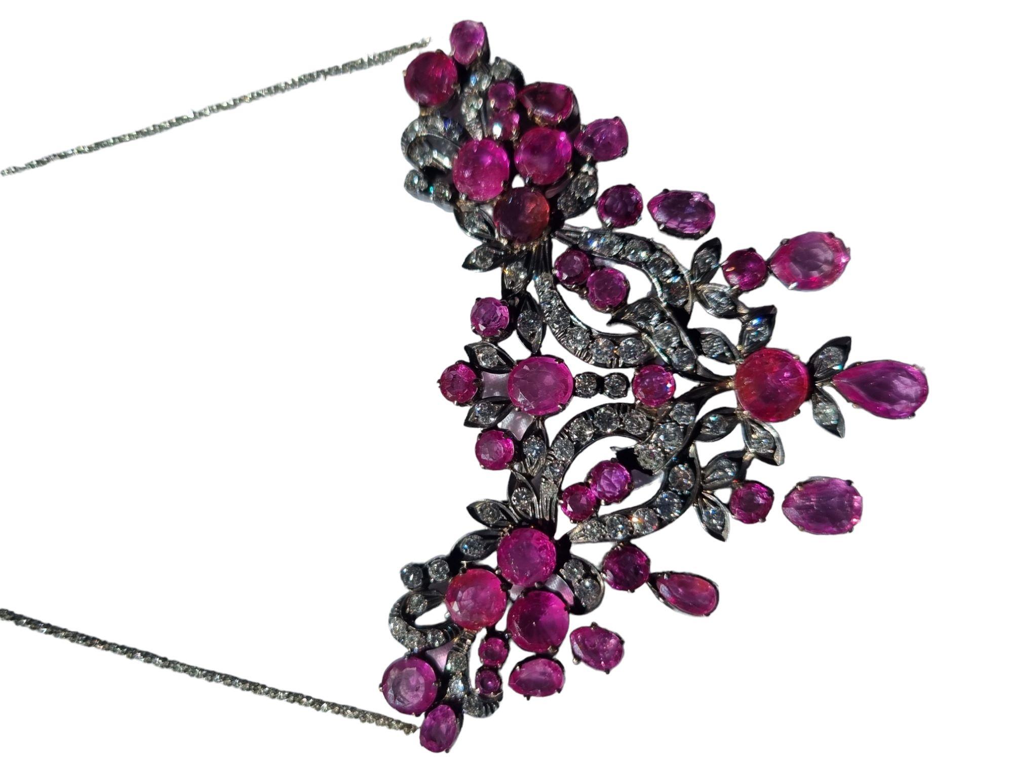 GIA certified Burmese unheated-untreated Ruby and Diamond Garland Necklace
Beautiful bright and shining necklace, hand fabricated in oxidized silver over 18K yellow Gold- circa First half-20th-Century.
GIA certified random (Report: 1206290093).