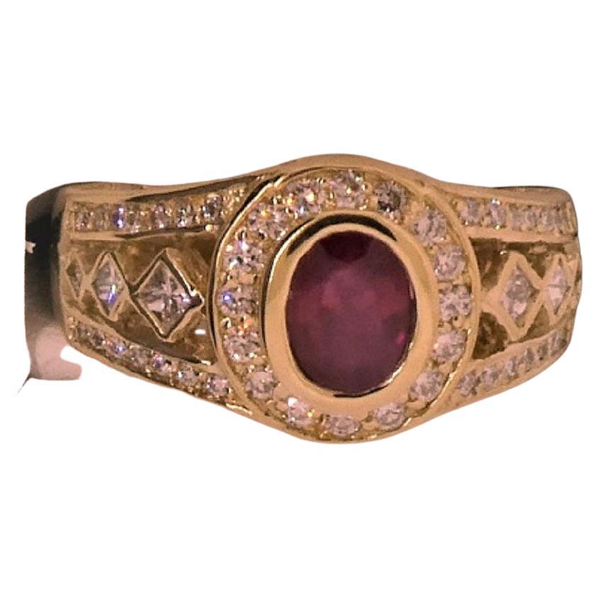 Set in an 18K yellow gold ring (12.73 grams), this GIA certified Burmese Ruby (report # 2195831447) describes a lovely stone that has only mild treatment and is surrounded by high quality diamonds.  The vivid red color described in the report, makes