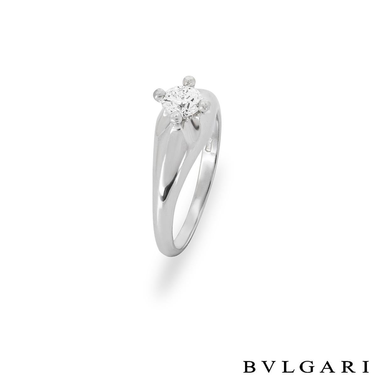 A stunning platinum diamond ring by Bvlgari from the Corona collection. The ring is set to the centre in a raised four claw mount with a round brilliant cut diamond weighing 0.33ct, D colour and VVS2 clarity. The tapered 6mm ring is currently a UK
