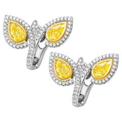 GIA Certified ByPass Earring with Fancy Yellow Pear Shape Diamonds