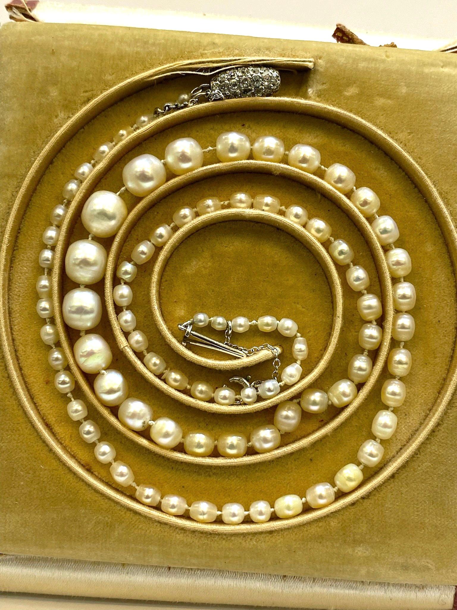 Cartier saltwater pearl necklace with original box. 85 natural Saltwater Pearls set together by a 56 round cut diamond set screw closure. 

This marvelous necklace is a true rarity. Dating back over 100 years and made by the famed French jeweler,
