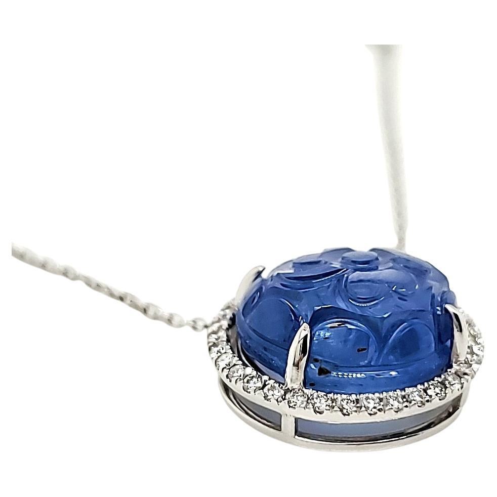 GIA certified carved, unheated Sri Lankan Sapphire pendant. 

It is seldom if ever, that one would find a carved and unheated Sri Lankan sapphire placed on a pendant. 
A definite conversation piece to wear. You are sure to be asked what the stone