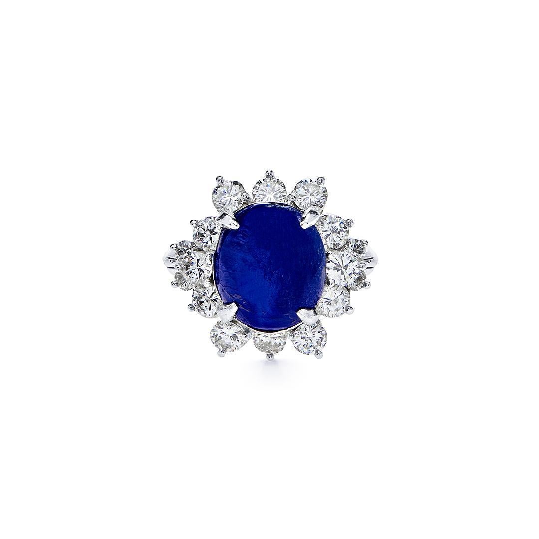 Elevate your style with our stunning Cabochon Cut Oval Blue Sapphire and Diamond Star Ring. This exquisite piece features a mesmerizing blue sapphire from Sri Lanka in a unique cabochon cut, set within a star-shaped design adorned with dazzling