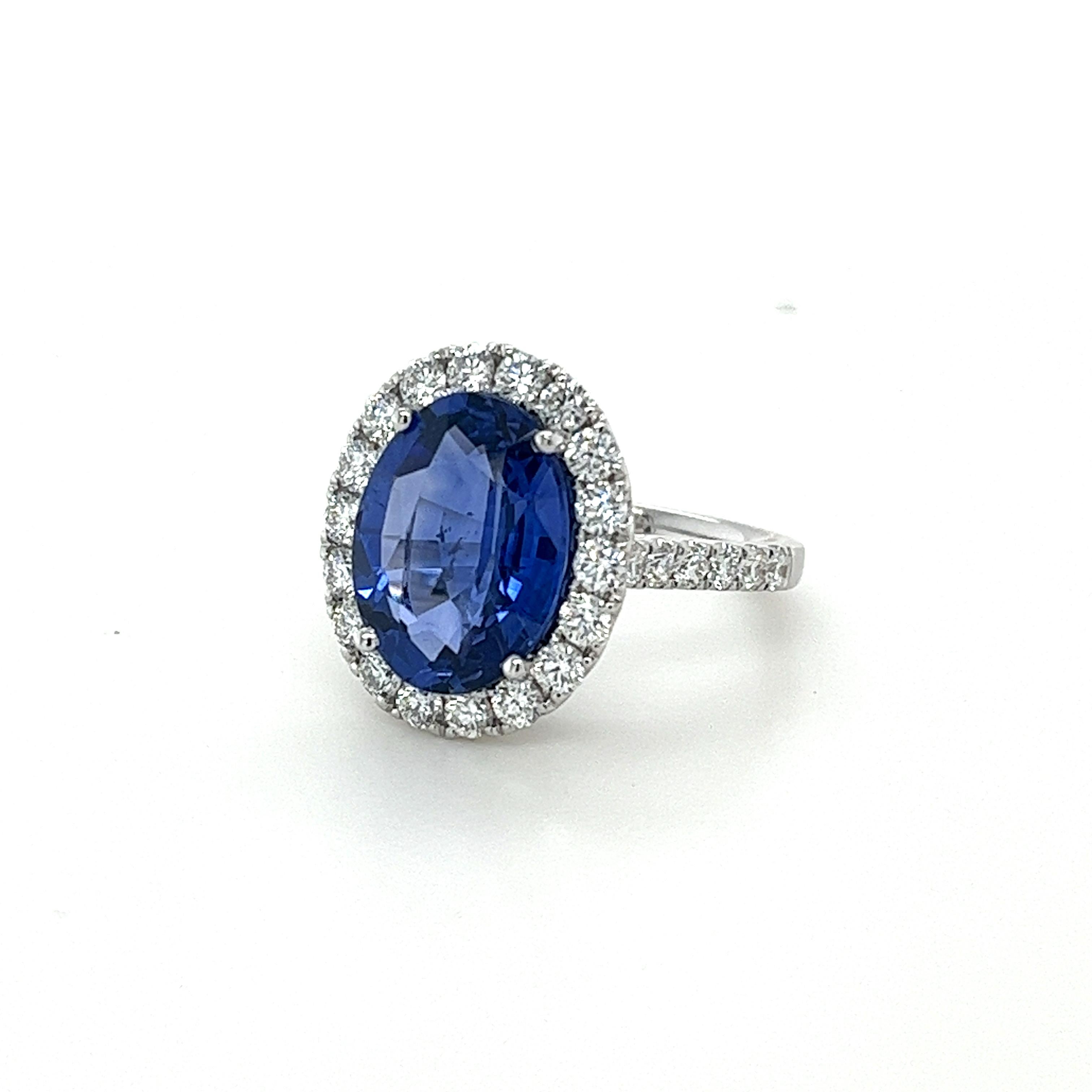 GIA certified oval Ceylon Sapphire weighing 5.94 carats
Measuring (13.22x9.96x5.25) mm
Diamonds weighing1.16 carats
Diamonds are GH-SI1
Set in 18 karat white gold ring
5.56 grams