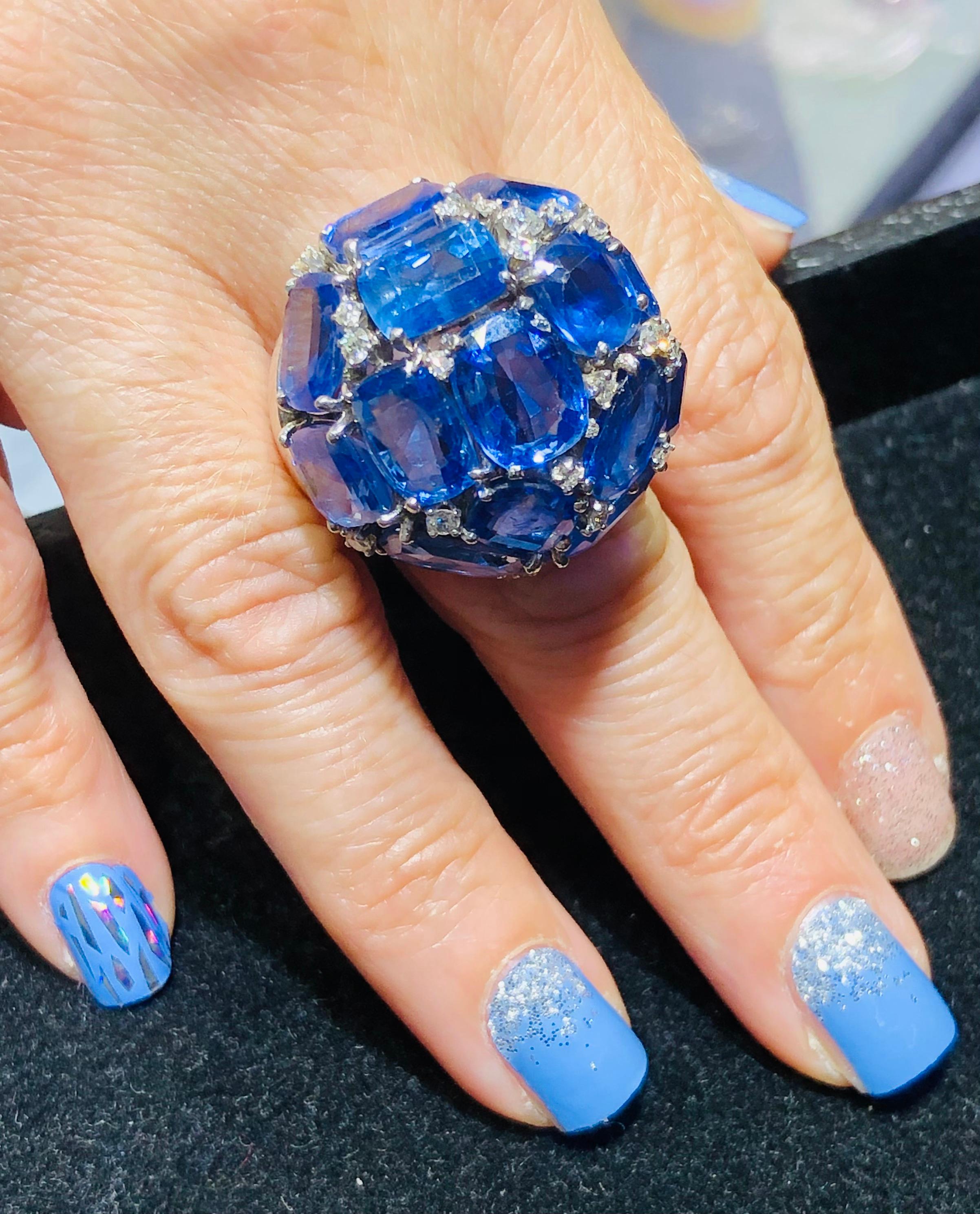 Beautiful vintage ring crafted in palladium. This large dome ring is adorned with natural Ceylon Sapphires and diamonds. The sapphires in this ring contain no heat treatment, as we sent two to GIA for certification # 5212732716. All sapphires in the