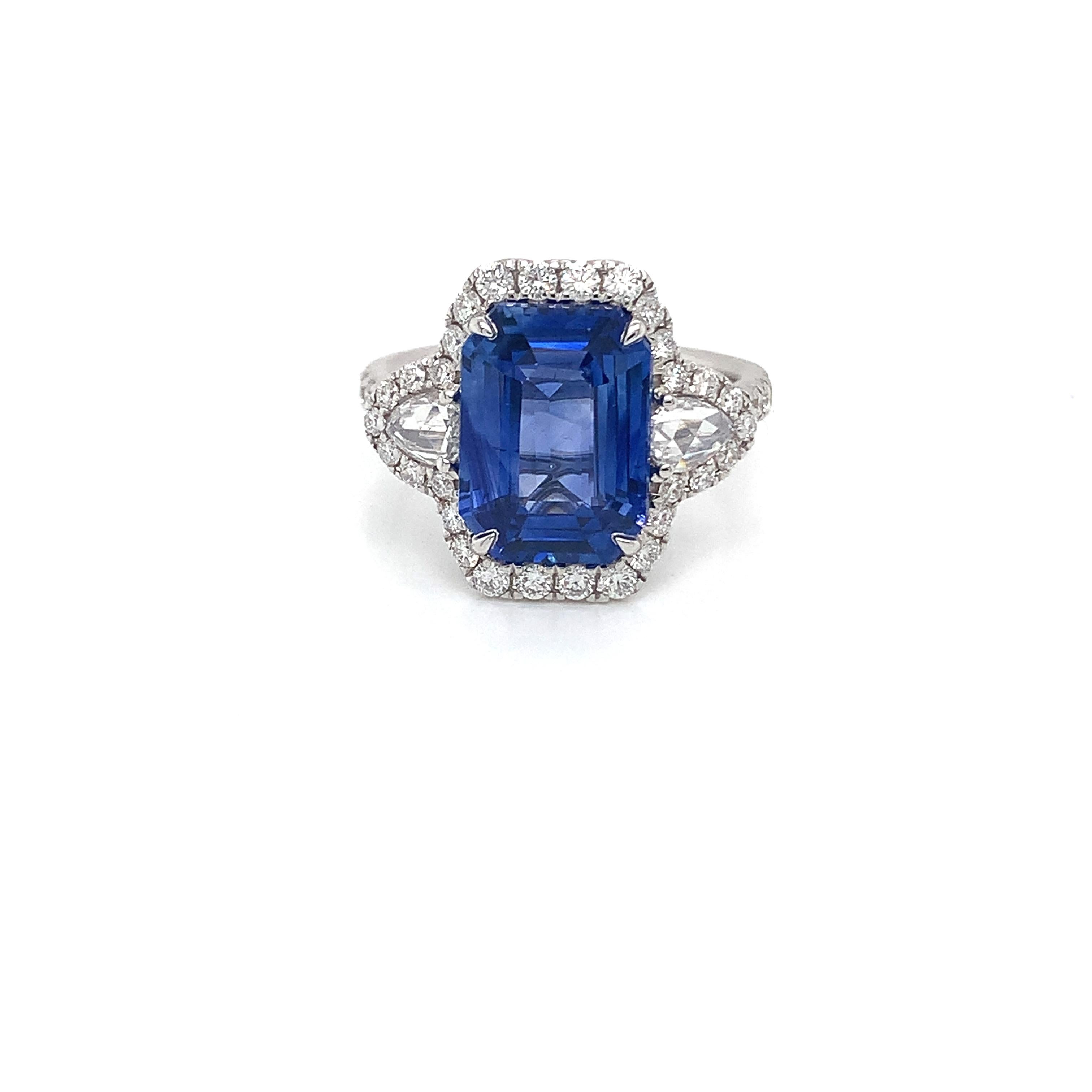 GIA Certified Ceylon sapphire weighing 5.50 cts
Measuring (11.86x8.68x5.12) mm
2 rose cut diamonds weighing .36 cts
42 round diamonds weighing .64 cts
Set in 18k white gold ring
