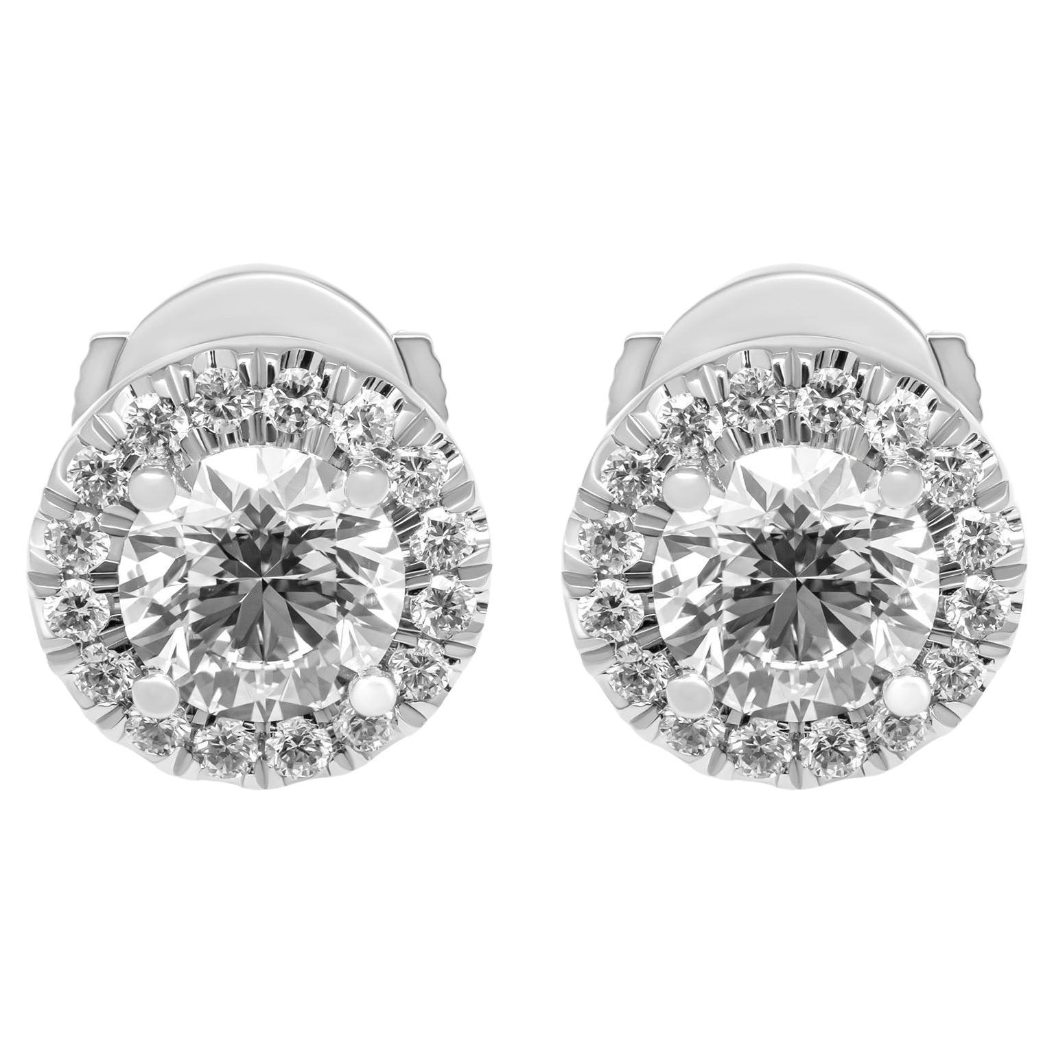 GIA Certified Classic halo studs 
In Platinum 
Stones:
0.61ct G VVS2 Round diamond GIA#2437372520
0.61ct G VVS2 Round diamond GIA#6422568170 
Total Carat Weight of pave on halo: 0.24ct