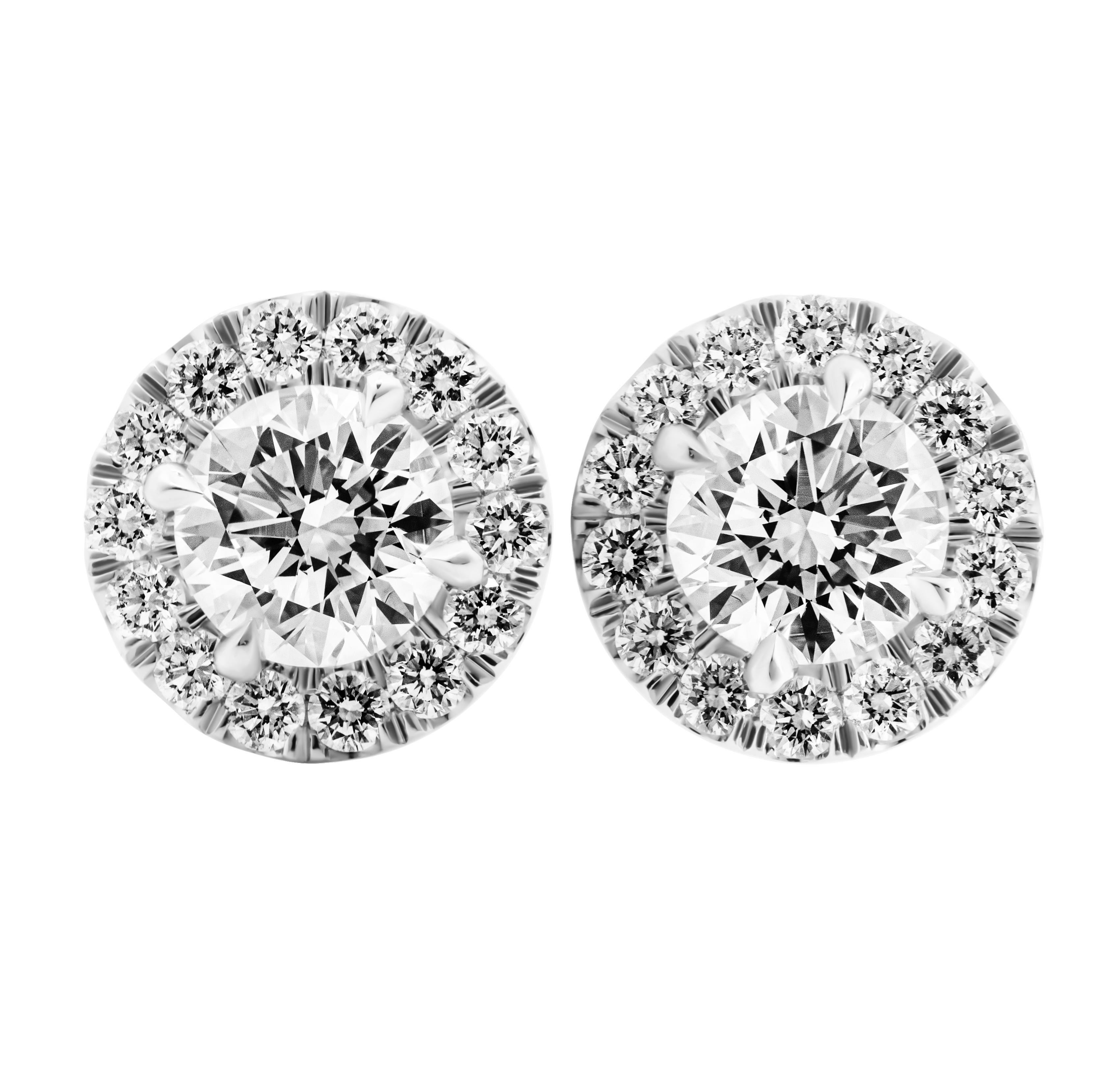 GIA Certified Classic halo studs in Platinum

Each stone is:
0.80ct G VS2 Round shape diamond GIA#1489797488
0.80ct G VS2 Round shape diamond GIA#6482775520

Surrounded by Pave halo totaling 0.59ct (28st)
