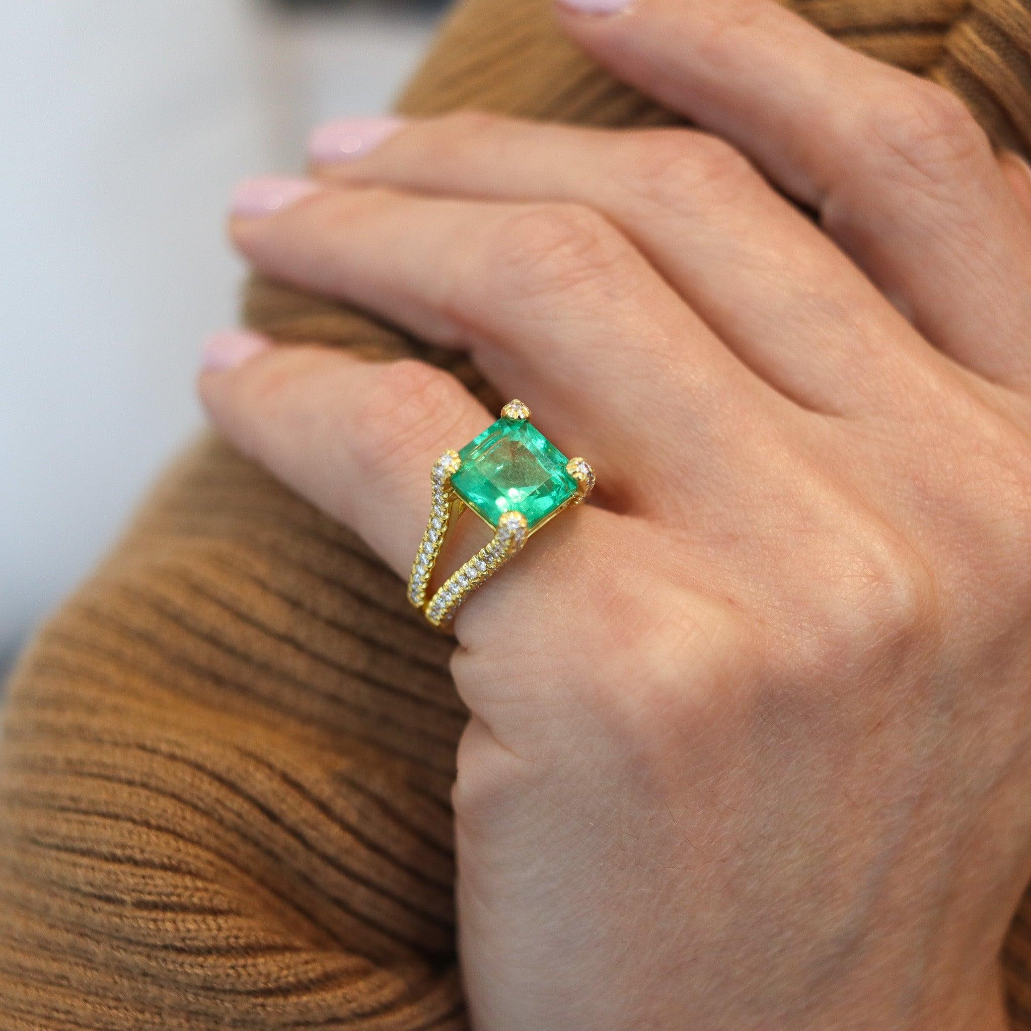 Cocktail ring with GIA certified Emerald and diamonds.

This is a gorgeous contemporary ring crafted in solid yellow gold of 18 karats with polished finish. The modern setting is embellished with a terrific selection of natural earth mined