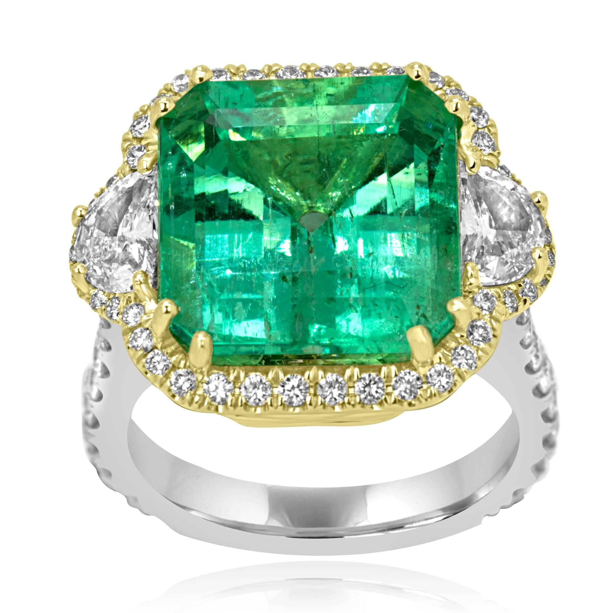 Stunning GIA Certified Colombian Emerald Cut Emerald 10.20 Carat encircled in a single Halo of Colorless Diamonds VS Clarity 0.90 Carat Flanked with 2 Colorless Half Moon Vs Clarity Diamonds 0.67 Carat on the Side  in 18K White and Yellow Gold one