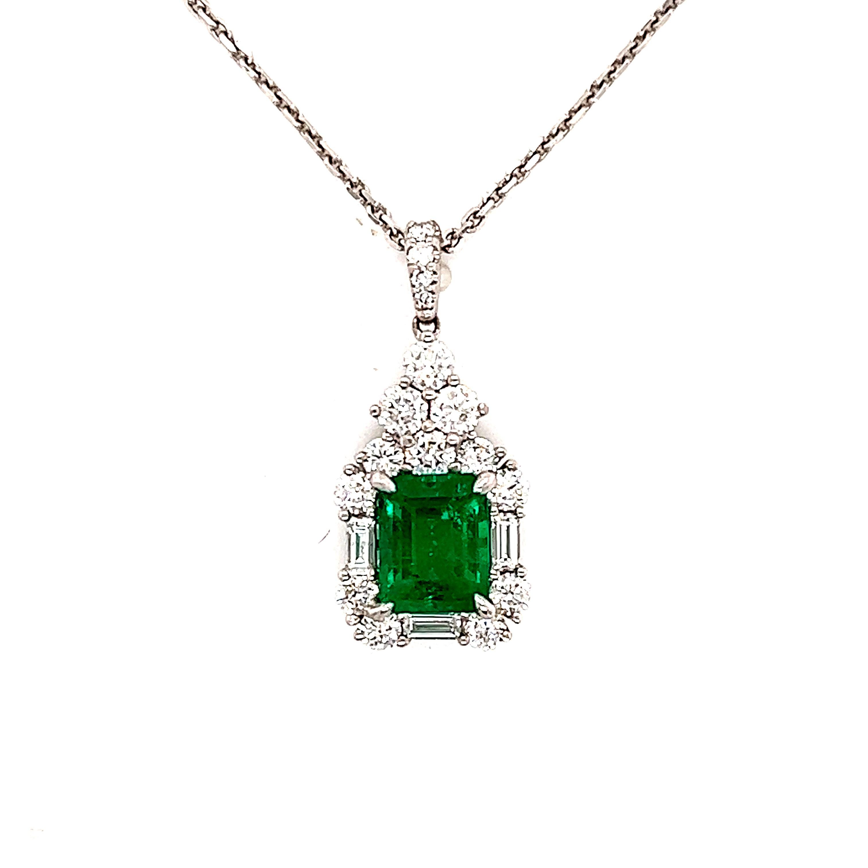 Gorgeous necklace crafted in 18k white gold. The highlight of the piece is the Colombian emerald that has a vivid pop of green color. The emerald gemstone is accompanied by a GIA report #2205936581. The center gemstone measures 8.35 x 6.58 x 4.41