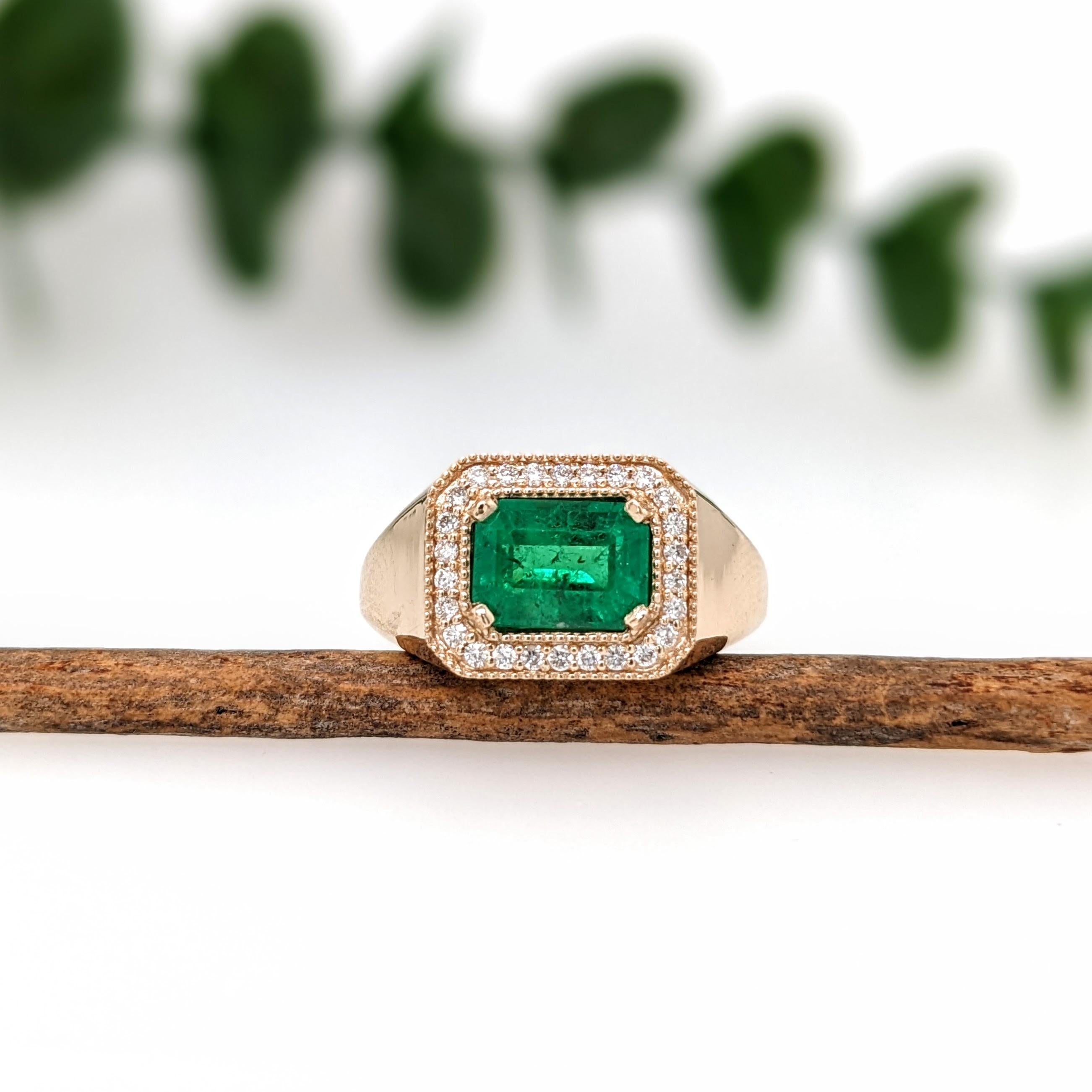 This beautiful east west ring features a 1.67 carat emerald cut Emerald gemstone with a halo of natural earth mined diamonds and milgrain detail, all set in solid 14K gold. This Colombian Emerald ring makes a lovely May birthstone gift for your