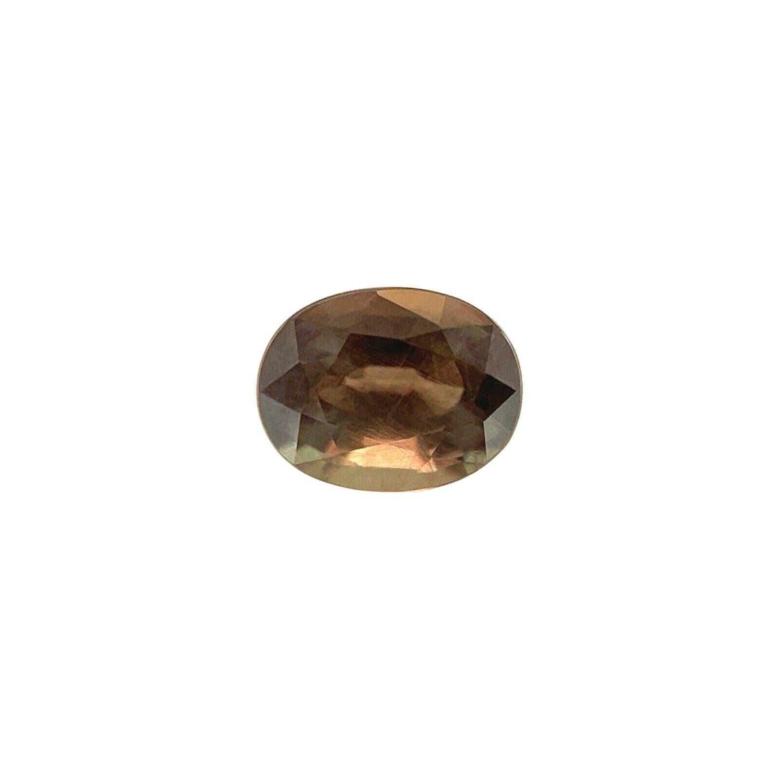 GIA Certificado Color Cambio Granate 0.88ct Piropo Espessartina Talla Oval Gema Rara en venta 5
