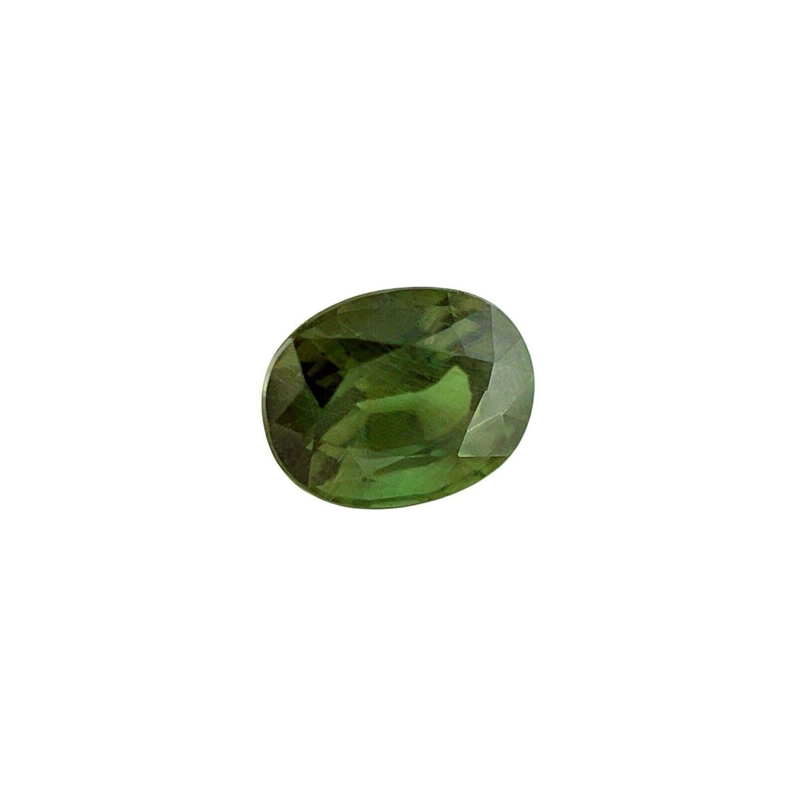 GIA Certificado Color Cambio Granate 0.88ct Piropo Espessartina Talla Oval Gema Rara en venta 6