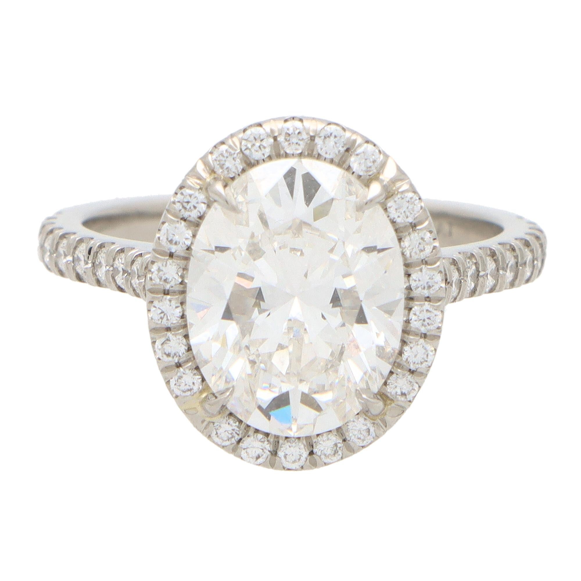 GIA Certified Contemporary Oval Cut Diamond Halo Ring Set in Platinum