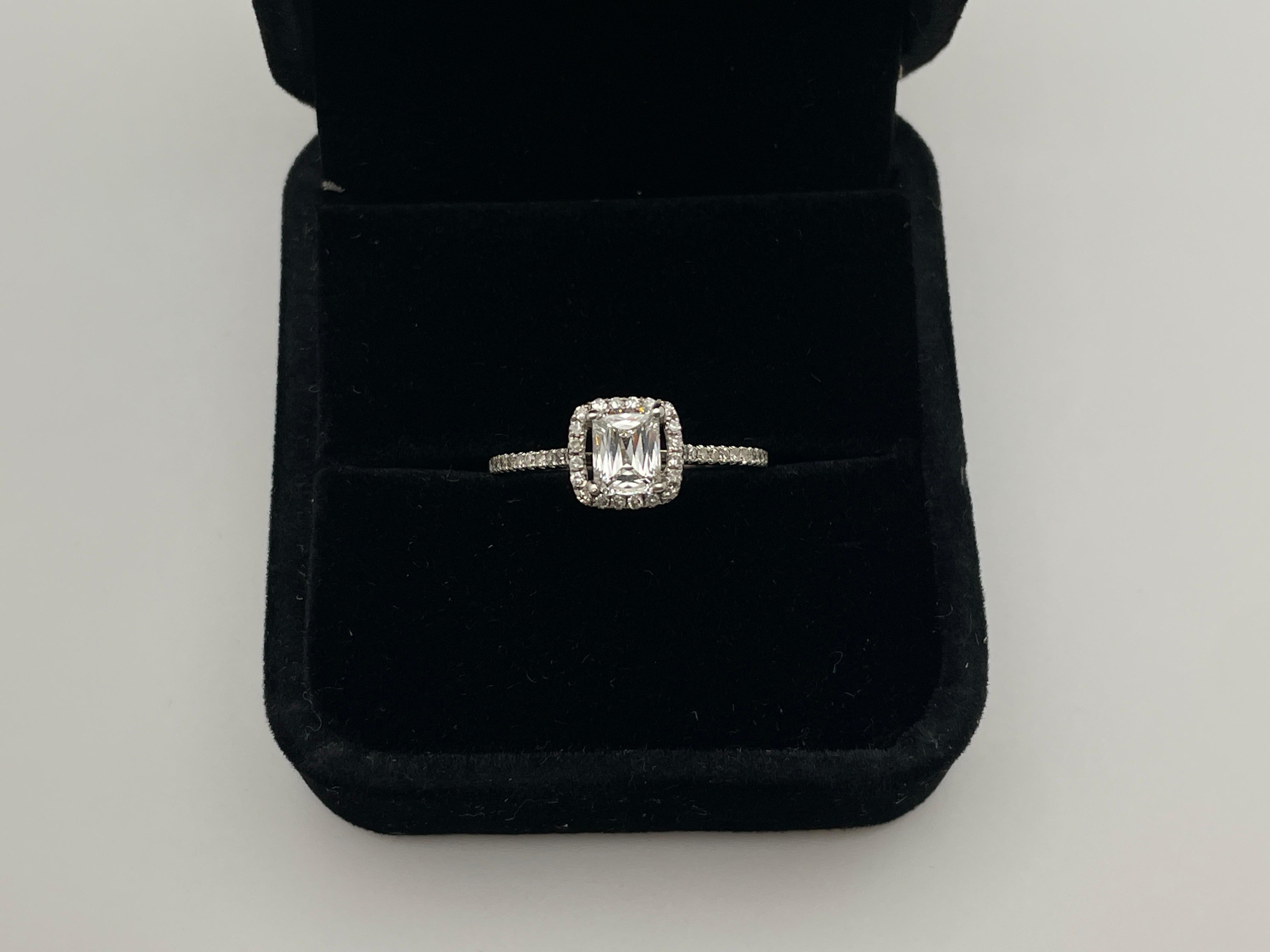 An original 18K white gold GIA certified criss cut diamond engagement ring. Mounted with a unique Crisscut diamond weighing 0.64 CT, G color, VVS2 clarity, and measuring 5.82 x 4.43 x 2.83 mm, (GIA Report No: 2221484003). Accented by 42 small single