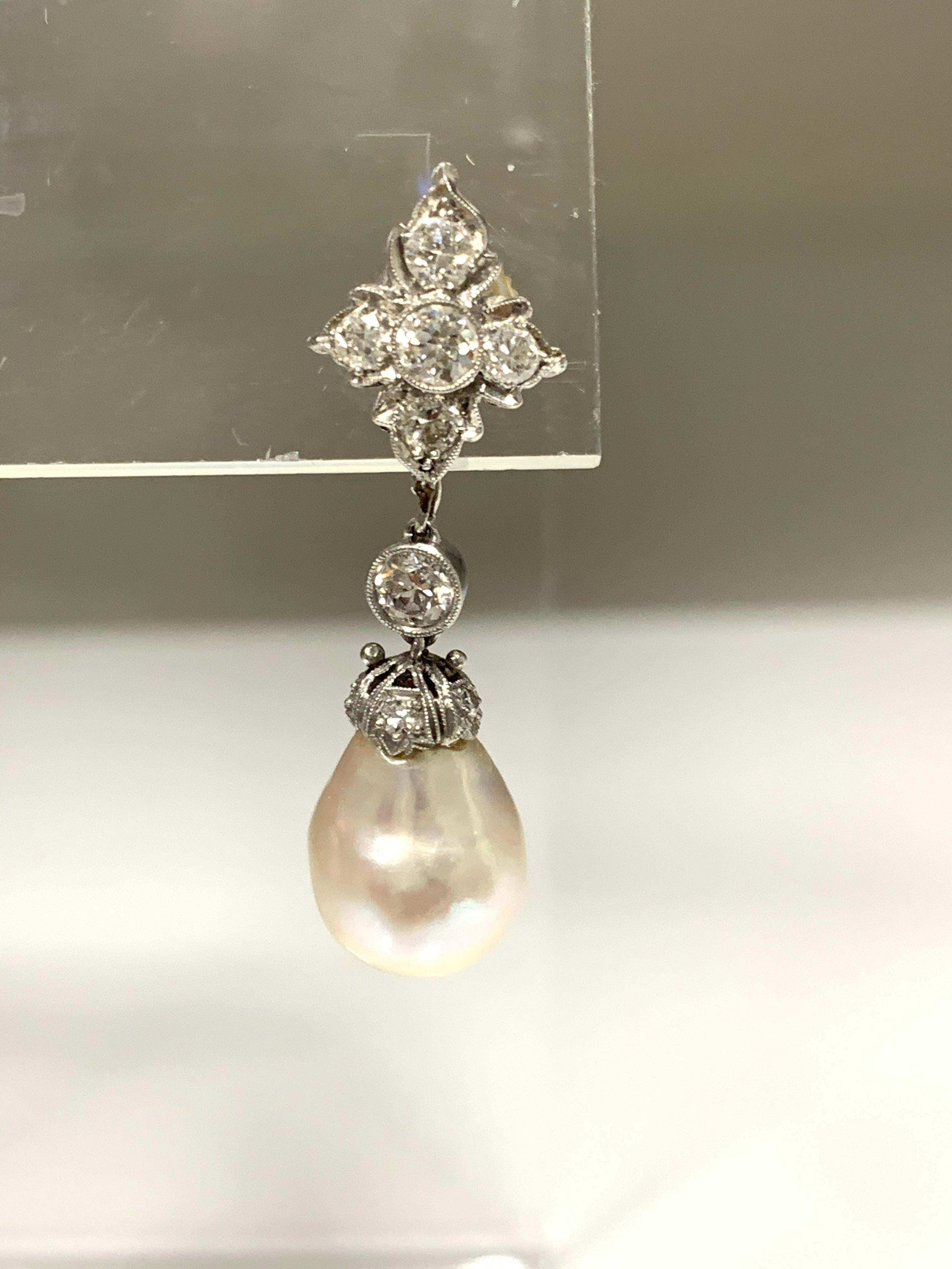 GIA Certified cultured pearl and diamond earrings are beautifully handmade. 
The details are as follows : 
Diamond weight : 1.30 carat approx  ( GH color and VS clarity ) 
Measurements (earrings ) : 1 1/4 inches long 
Pearl description :  quantity -