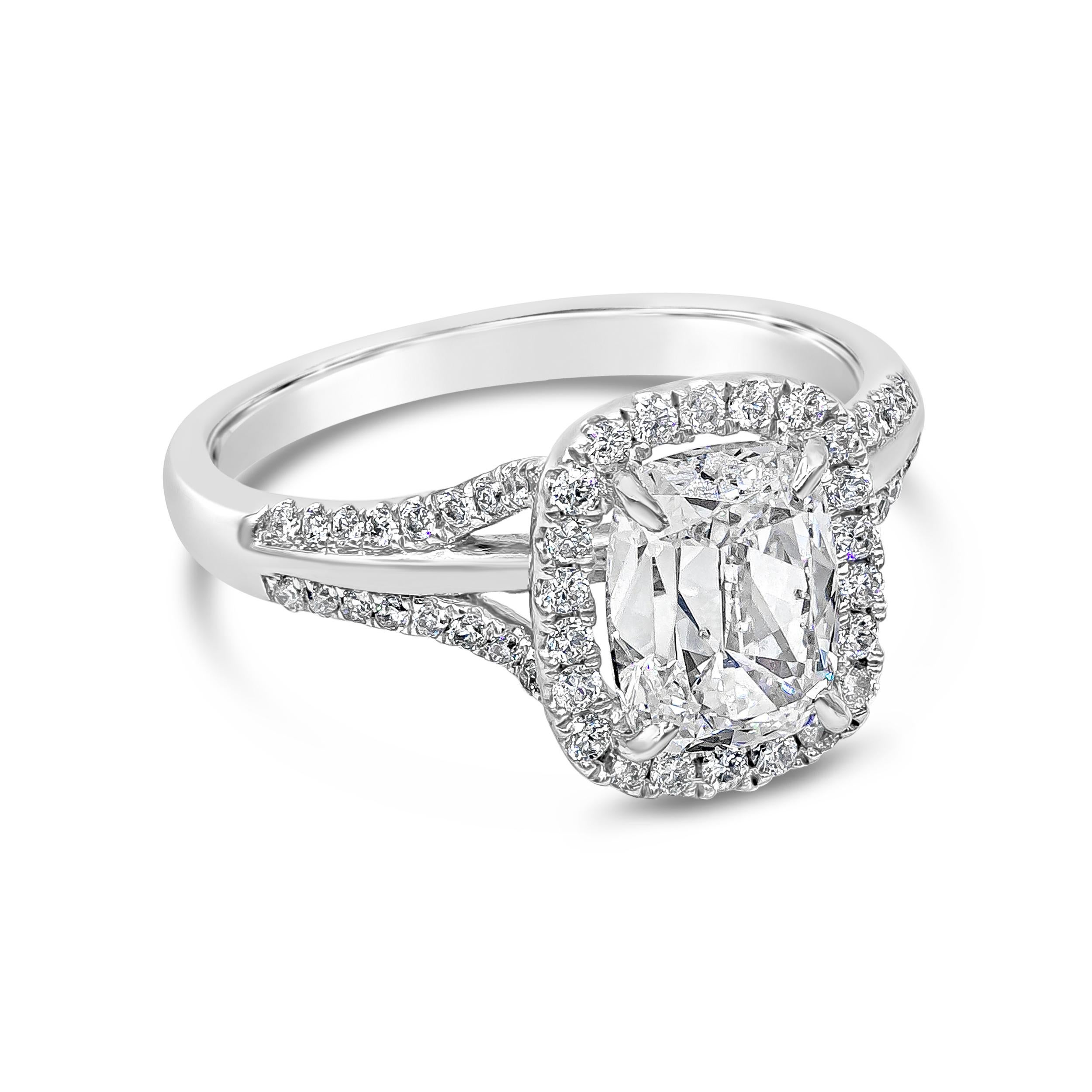 Showcasing a 1.66 carat cushion brilliant diamond certified by GIA as D color, SI2 clarity, surrounded by a single row of round brilliant diamonds. Set in a chic split-shank setting accented with diamonds. Accent diamonds weigh 0.33 carats total. 