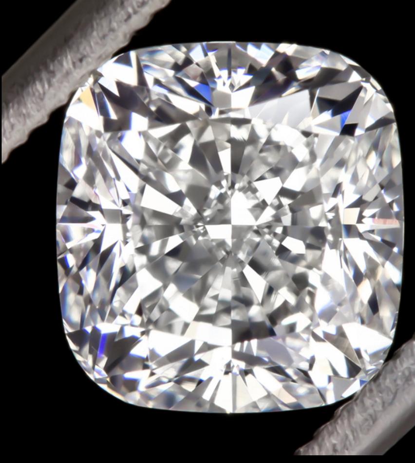 2.50 carat GIA certified cushion cut diamond is completely eye clean, bright white, and it sparkles stunningly with vibrant brilliance! Well cut, the diamond’s sparkle is bright and well defined rather than the crushed ice look commonly found in