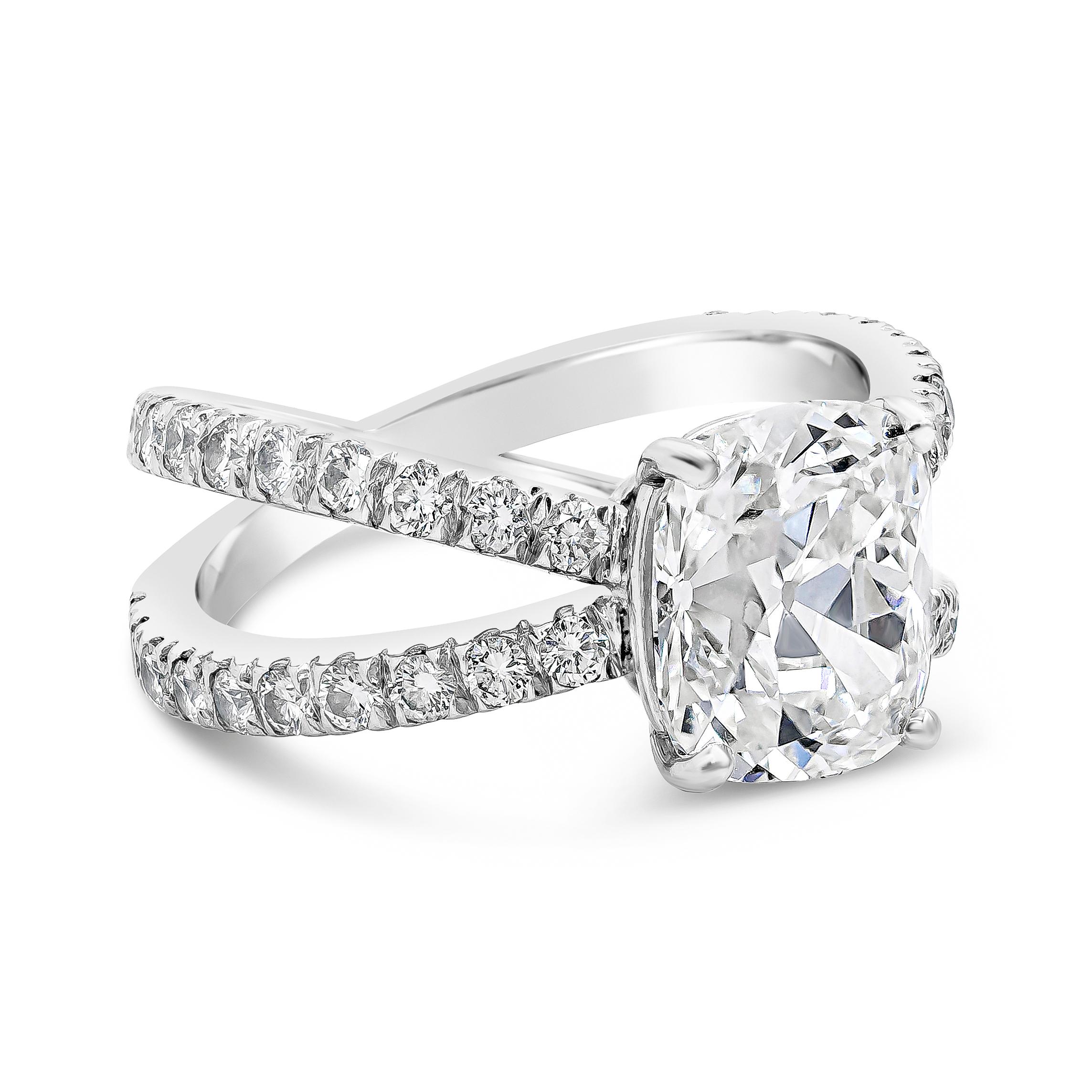 A unique engagement ring style showcasing a 3.02 carat cushion brilliant diamond, set in an ardent split-shank setting accented with round brilliant diamonds weighing 0.72 carats total. Made in platinum. Accompanied by GIA report stating the the